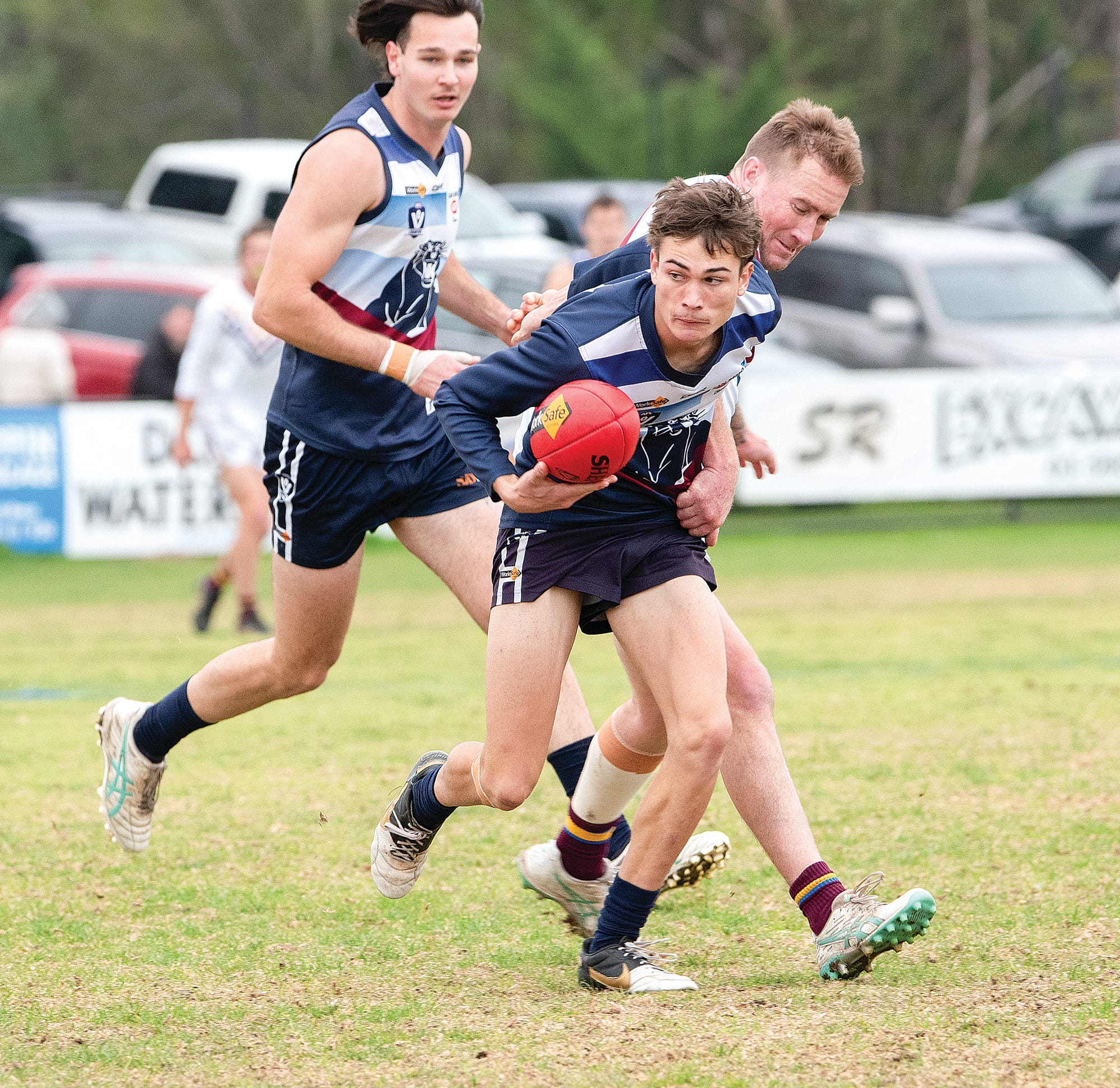 Owen Thomas words to break free from his opponent and move the ball forward for Kilcunda-Bass. Photos Anna Carson