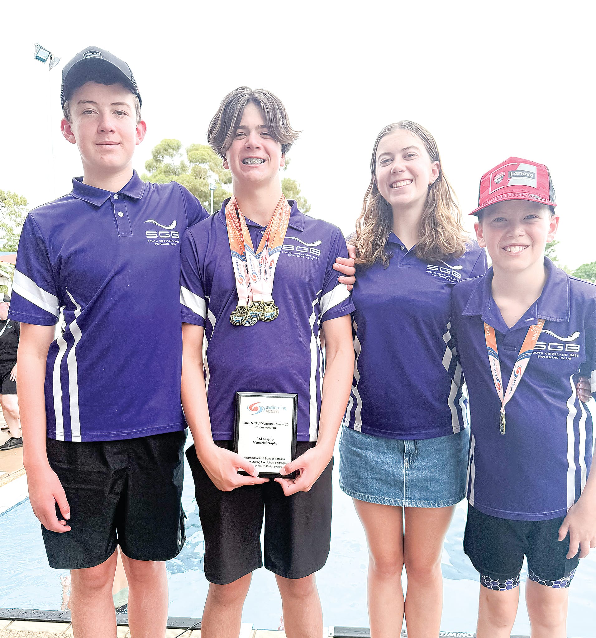 Celebrating their family success are Aidan, Archie, Lara and Darby.