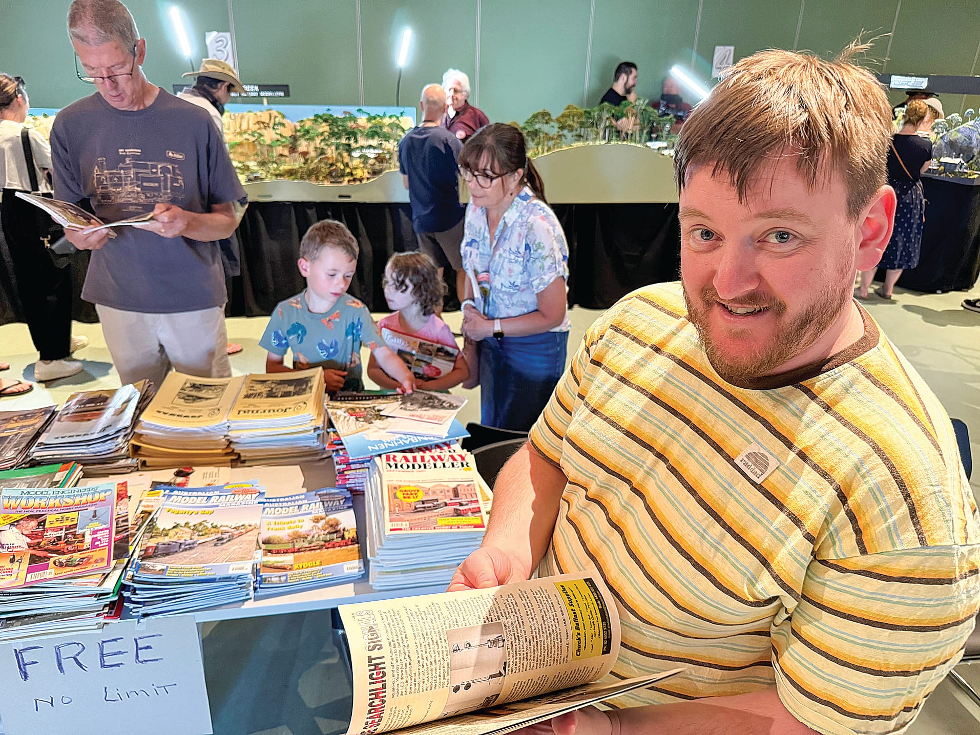 Shaun Woollard of Berwick flips through some of the railway magazines available for sale at Philip Island Model Railway Exhibition at the weekend.
