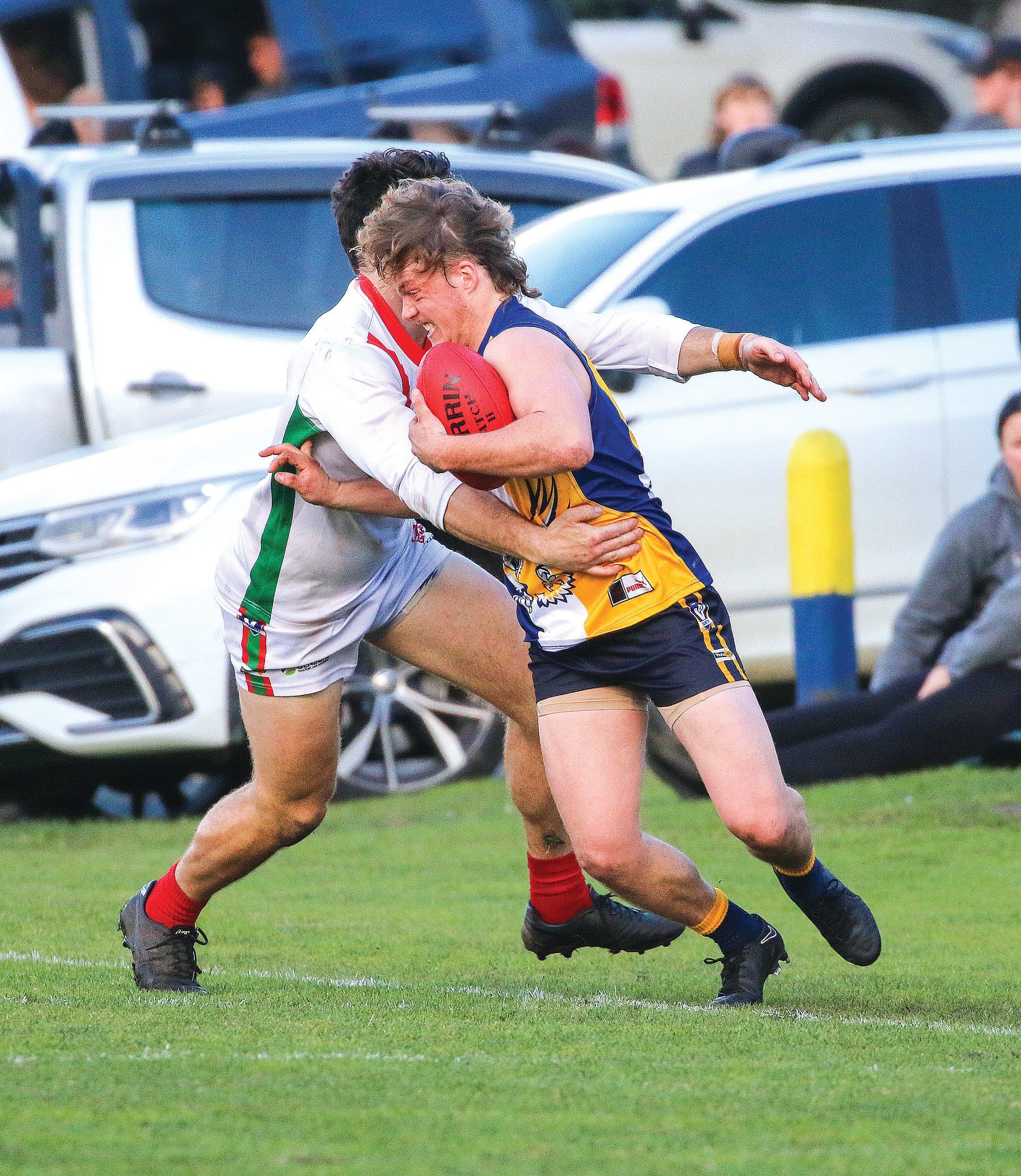 Inverloch Kongwak’s William Turner fights to break free of his opponent.