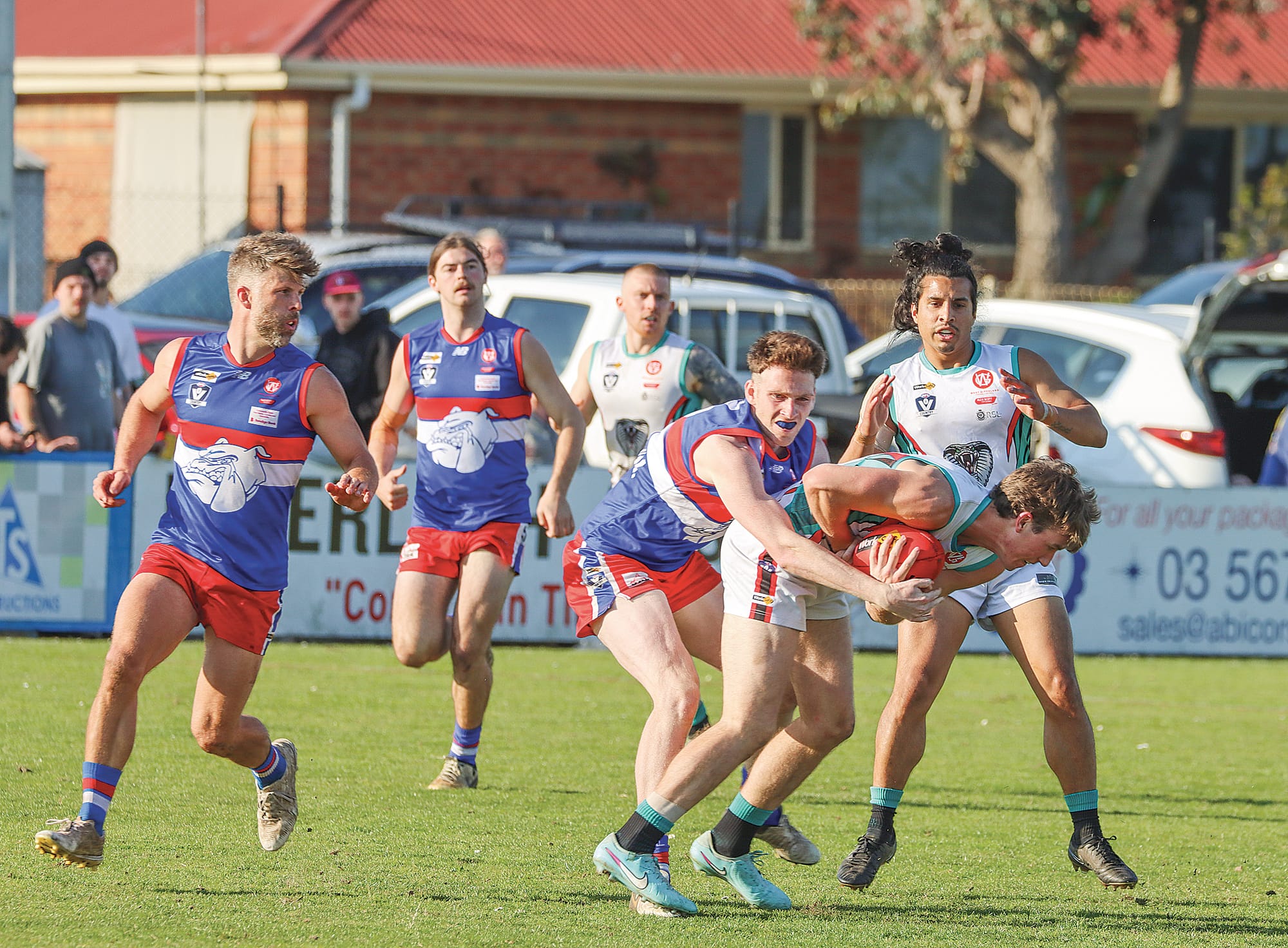 Phillip Island’s Jordy Patullo tackles Jett Edwards of Cora Lynn. A33_3625