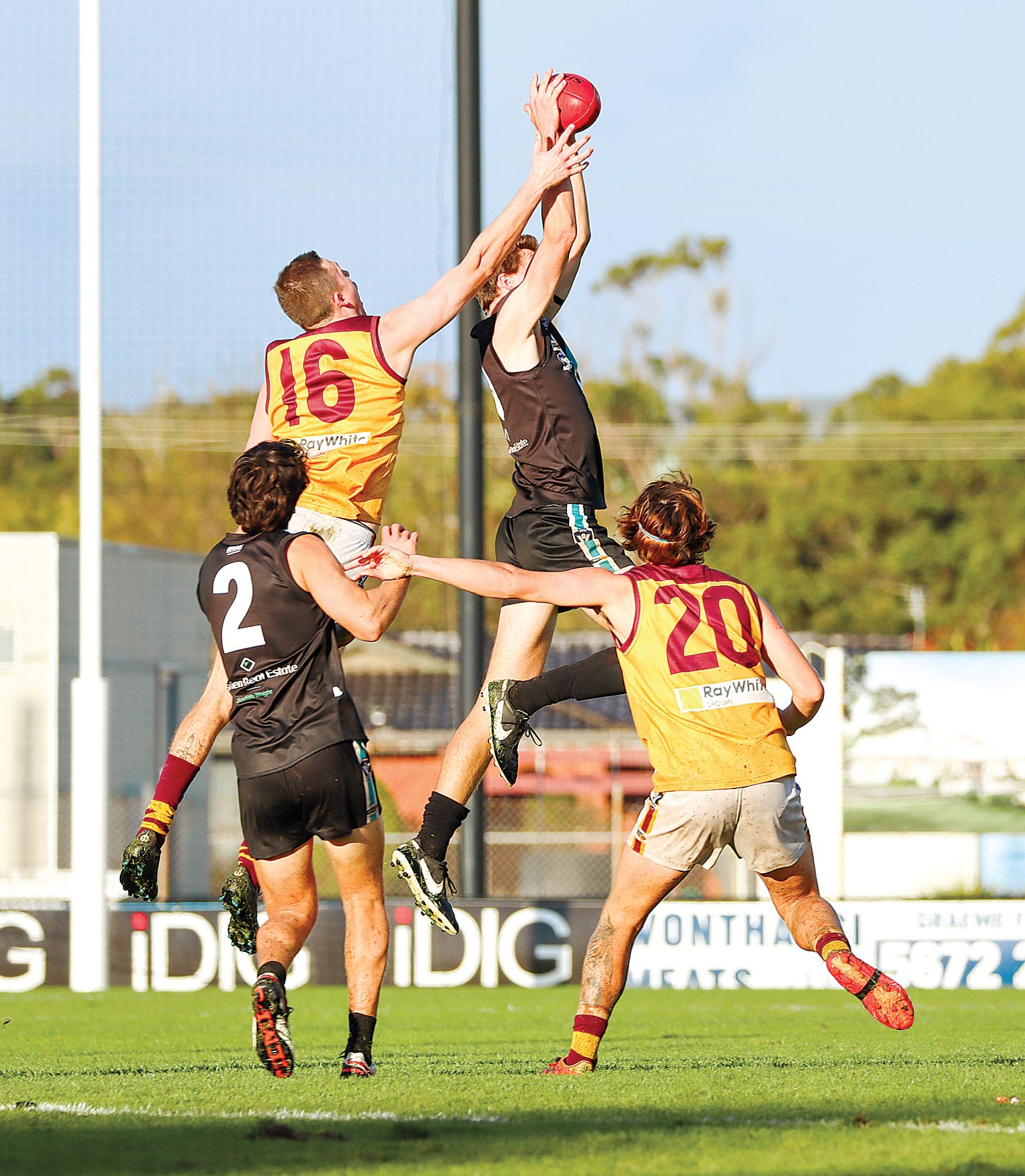 Wonthaggi and Drouin battle it out late in their close contest, with Power prevailing. A37_1923