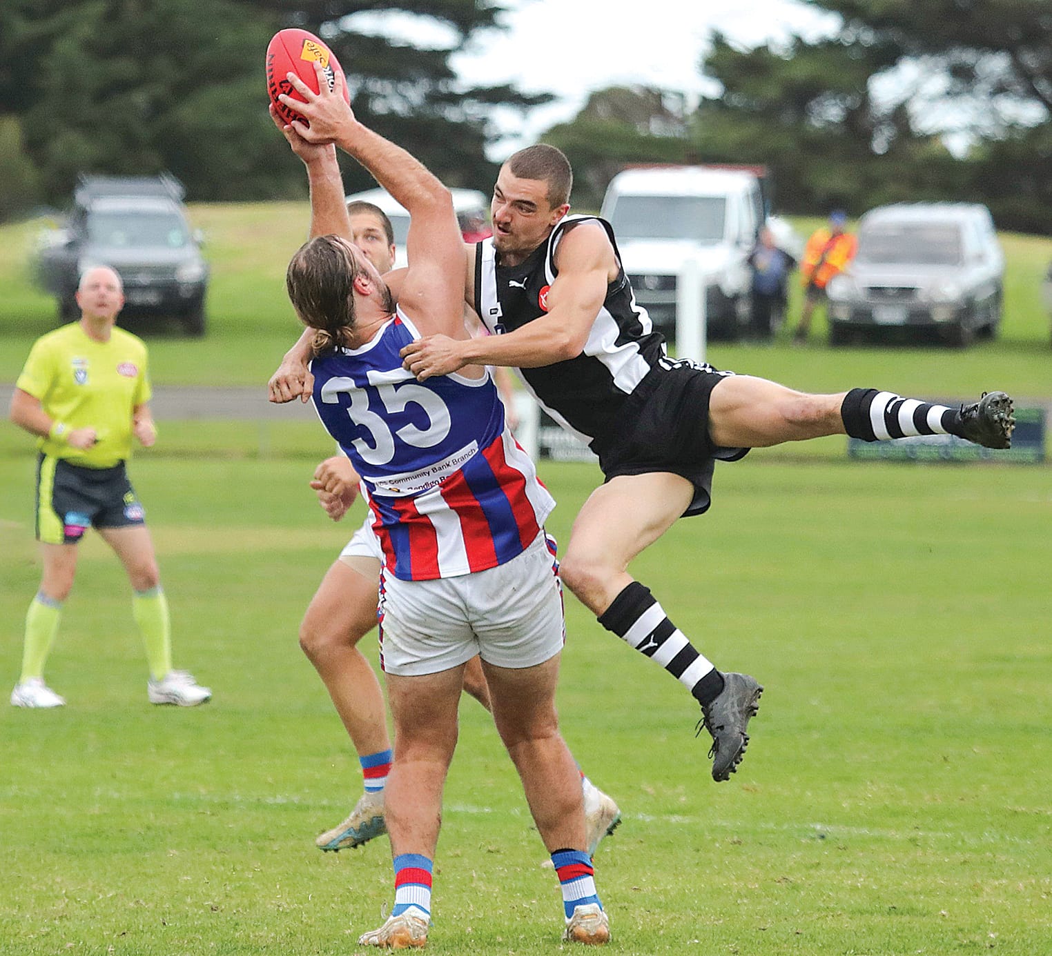 Jack Taylor gets the mark just as Cooper Smith crashes in for a spectacular tackle.
