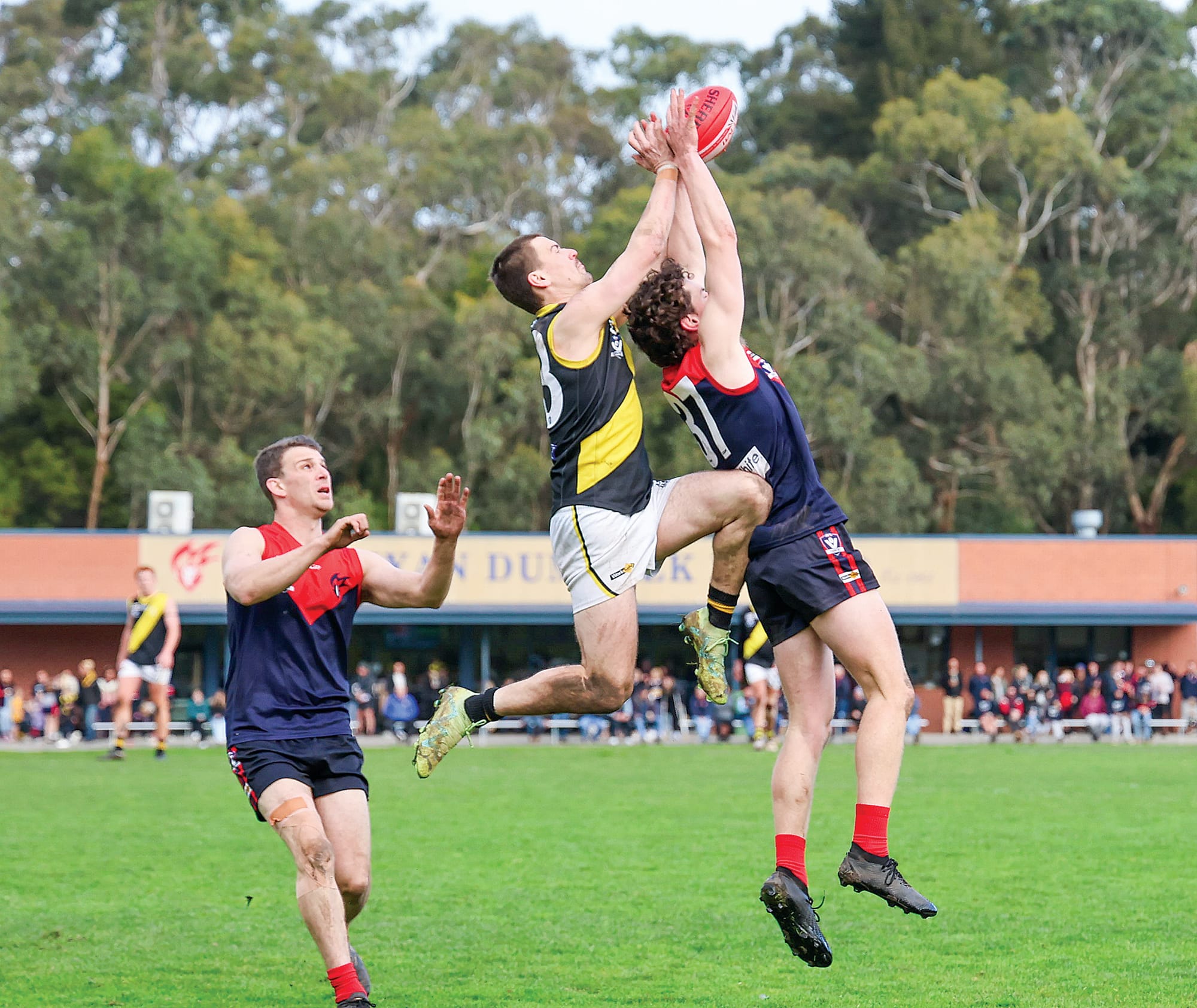 MDU defender Joel Leeden gets the front position ahead of busy Mirboo North forward Rhys Kratzat to cut another Tiger attacking move short.
