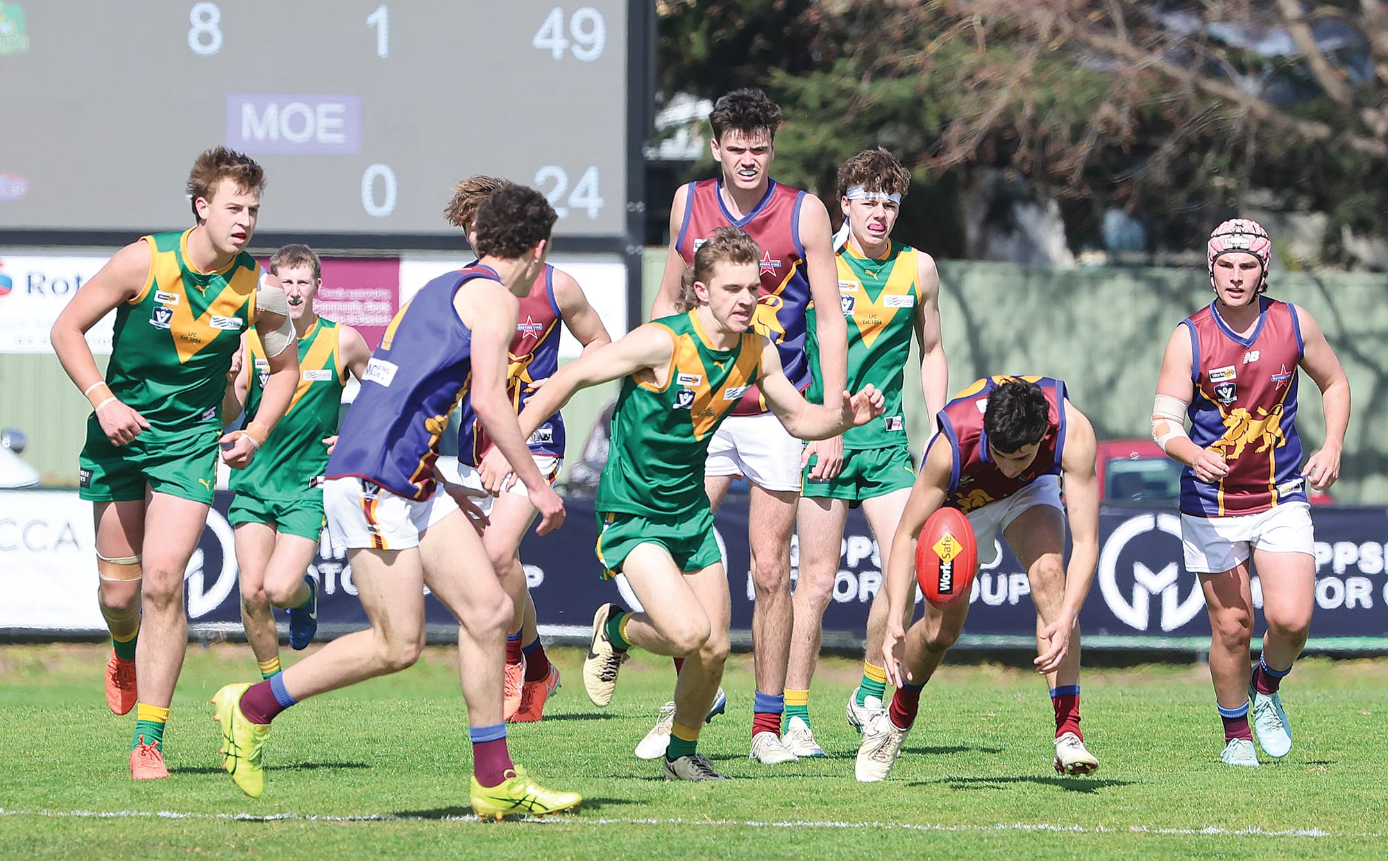 The score’s on the board in the fourth quarter as Leongatha Under 18 player Kade Berryman tracks down his Moe opponent.