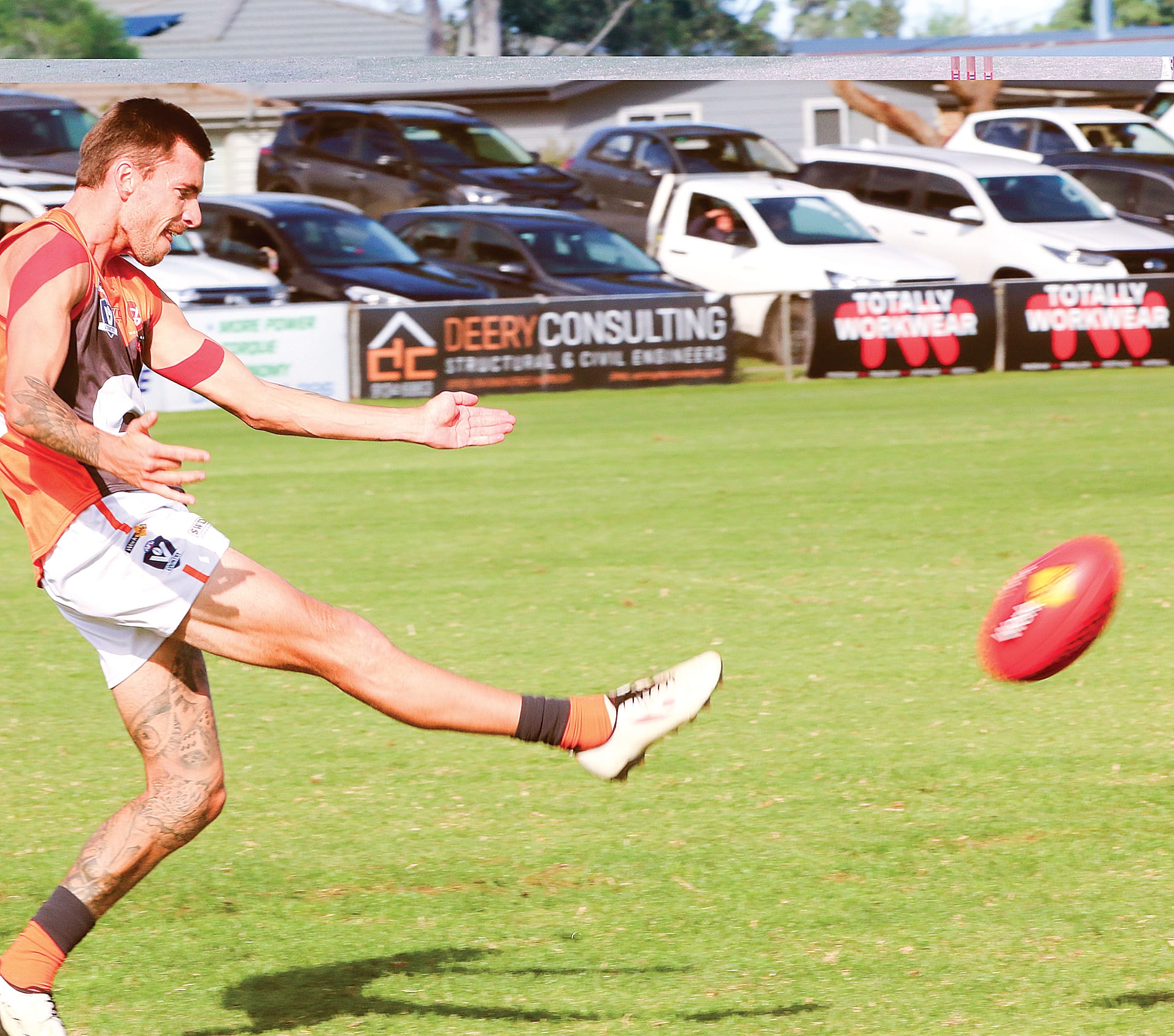 Josh Hopkins clears the ball for the Giants in defence. C83_1824