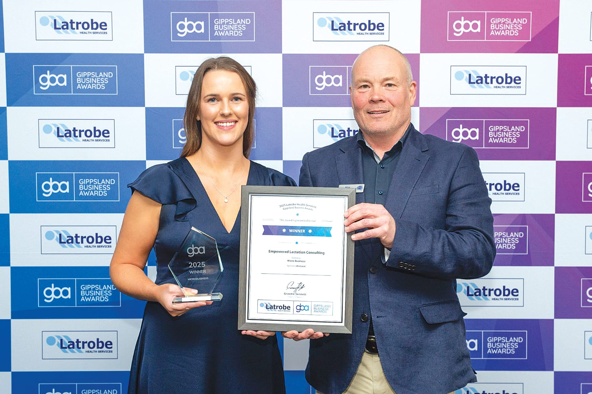 Alex Aeschlimann from nbn Local is pictured presenting Sarah Long from Empowered Lactation Consulting with her award.