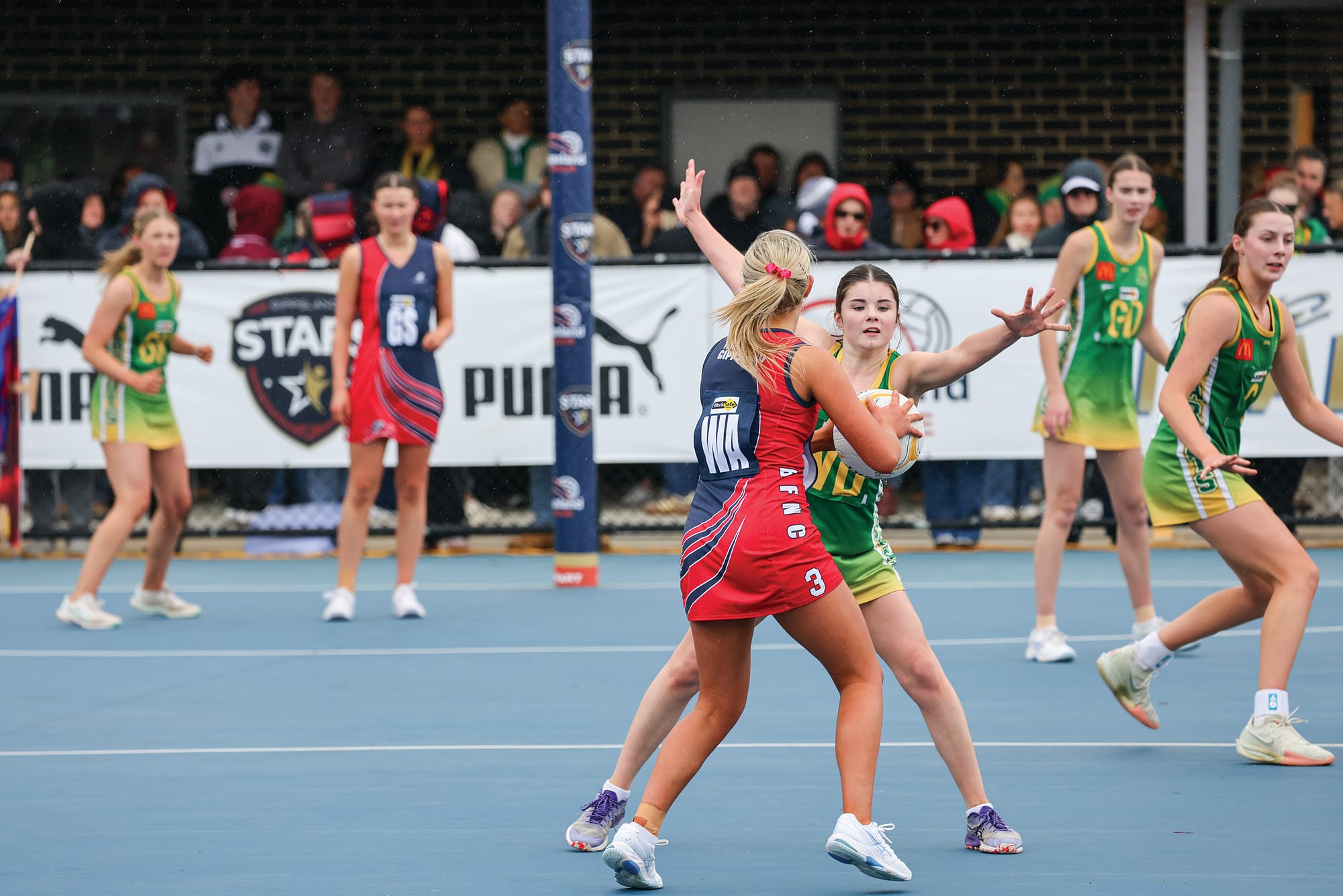 Mia Yates only has eyes for the ball as she defends well. W13_3825