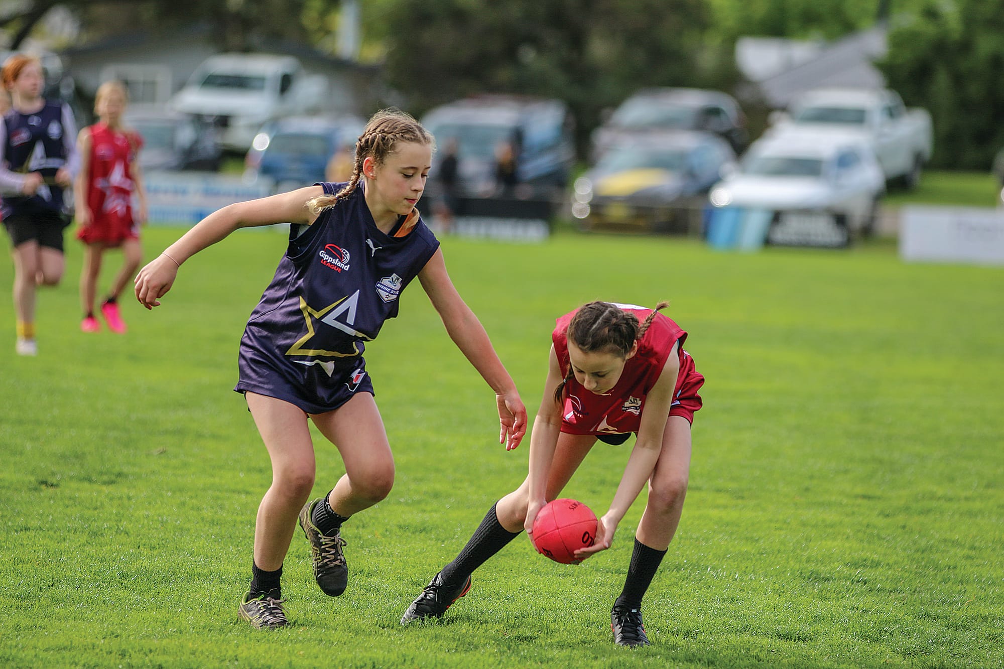 Madison Oxley protected the ball from Makenzie Kranen in the U12 girls’ exhibition match.