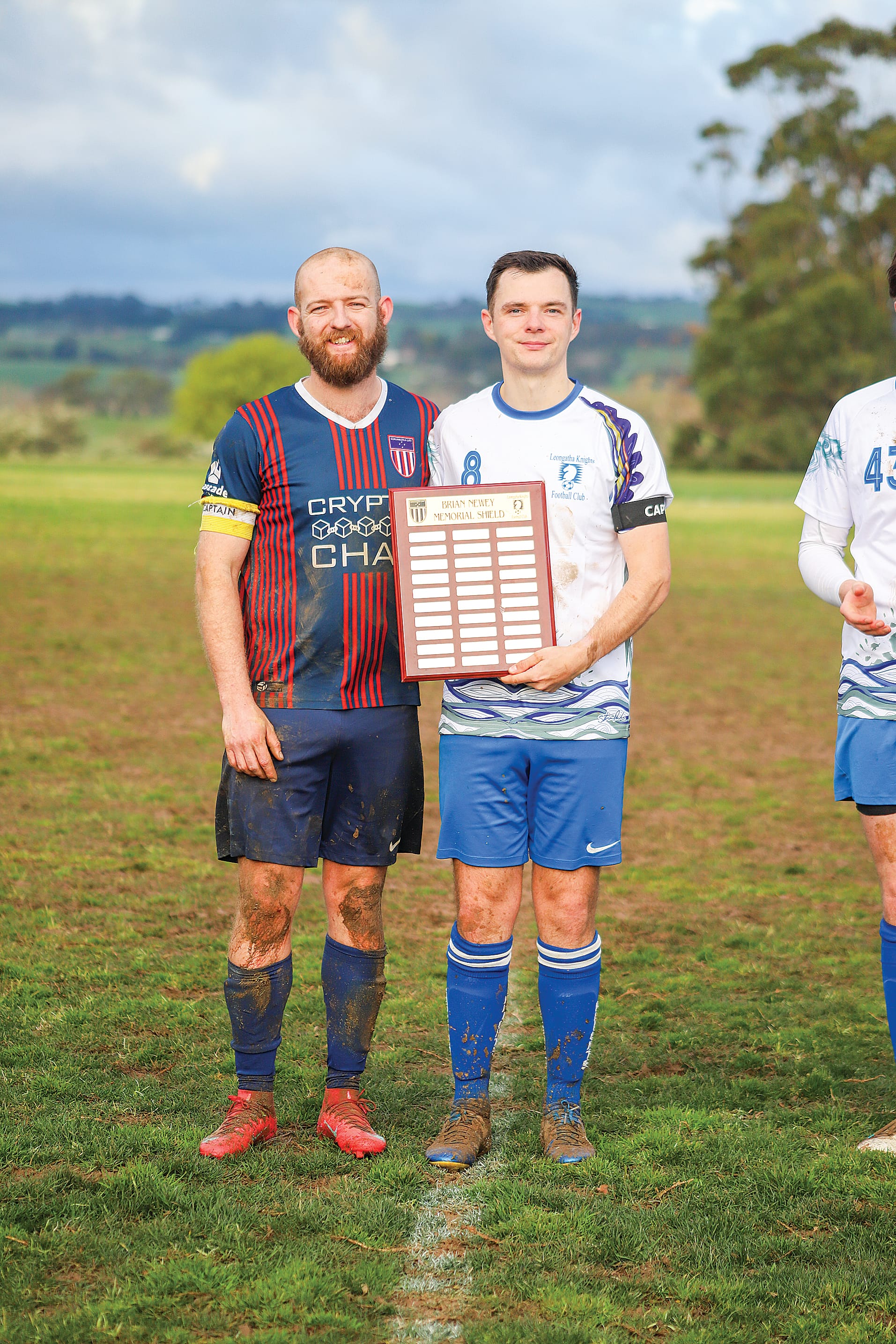 Korumburra’s Senior Men’s captain Hayden Smith and Leongatha’s captain Luke Knights with the Brian Newey Memorial Shield