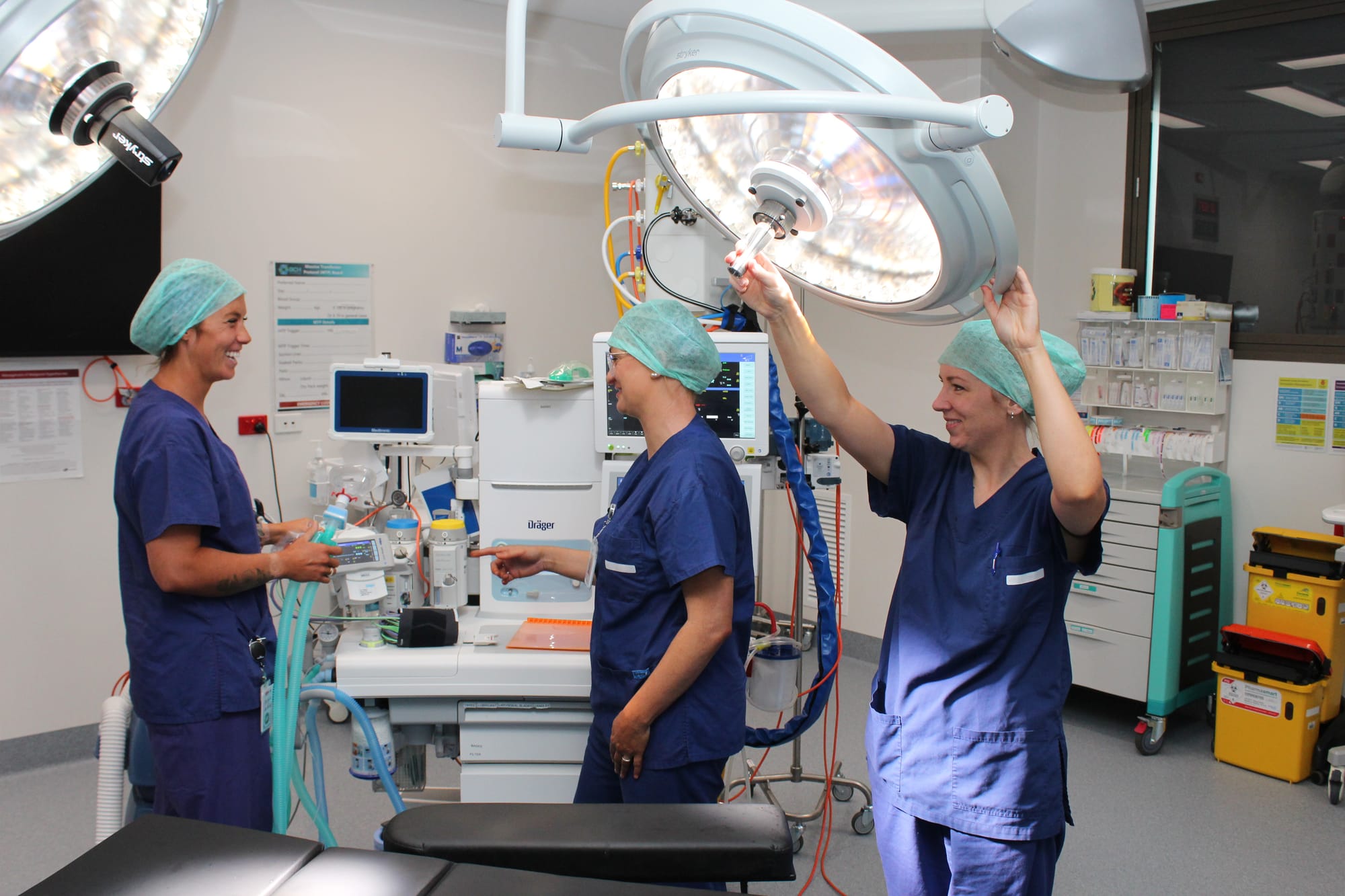 Theatre Nurses Alyssa Hughes, Meg Fitzgerald and Jodie Kilner check equipment in a modern operating theatre at Wonthaggi Hospital.