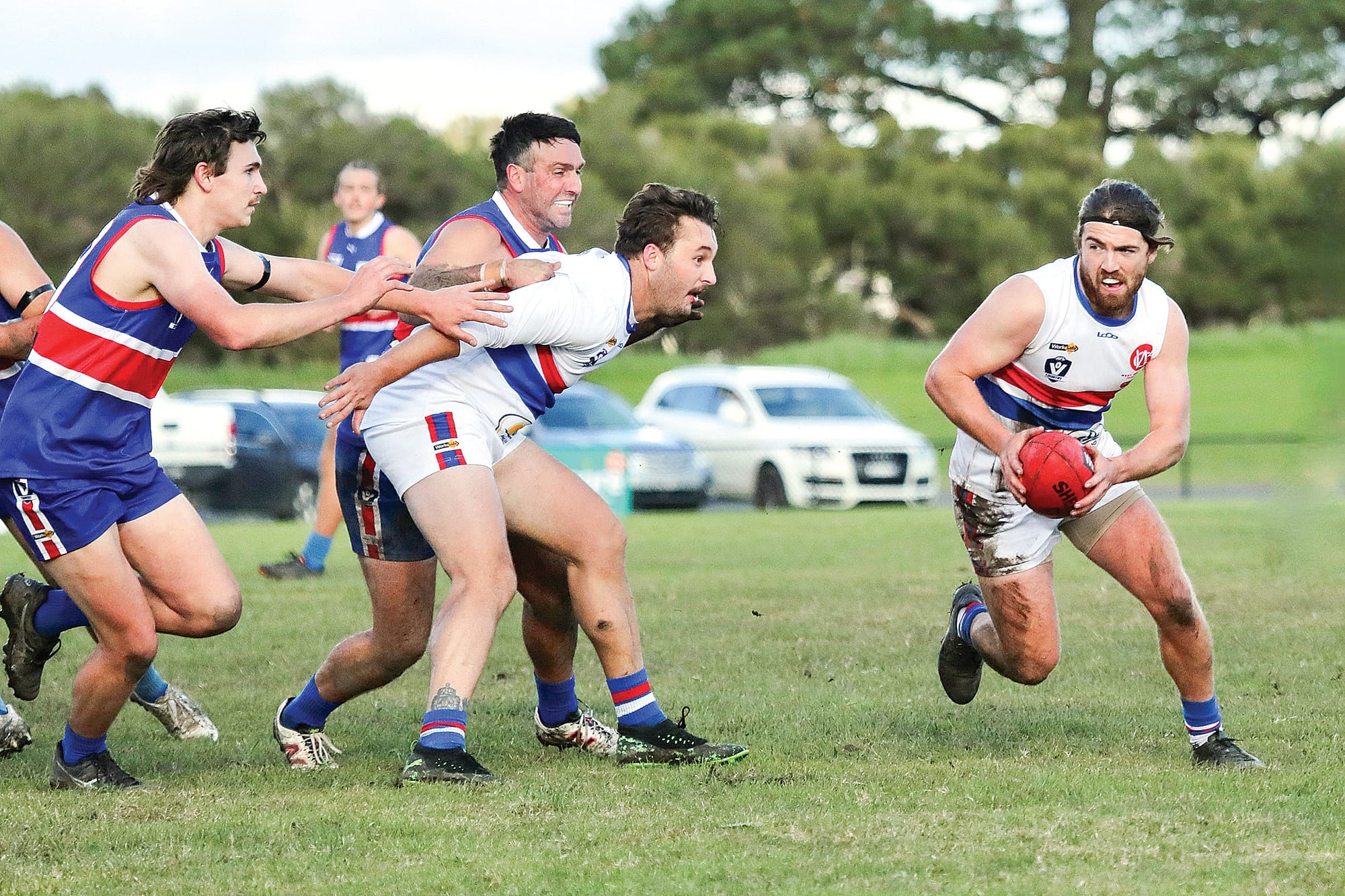 Cam Brown is defended by Alex Duyker who holds back their opponents.