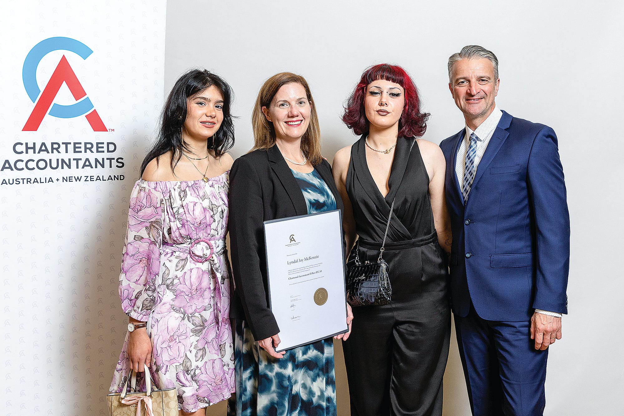 Lyndal with her daughters Kyla and Camryn, and husband Paul at the Chartered Accountants Australia New Zealand presentation ceremony.