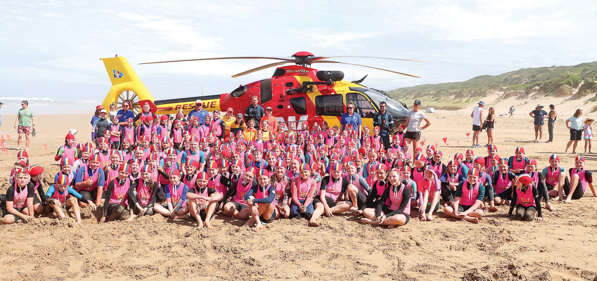 Nippers from Venus Bay Surf Life Saving Club are keen to ask questions of pilot Pete Nelson, and aircrewman Jack Slykhuis during the Westpac Rescue chopper visit. A03_0224