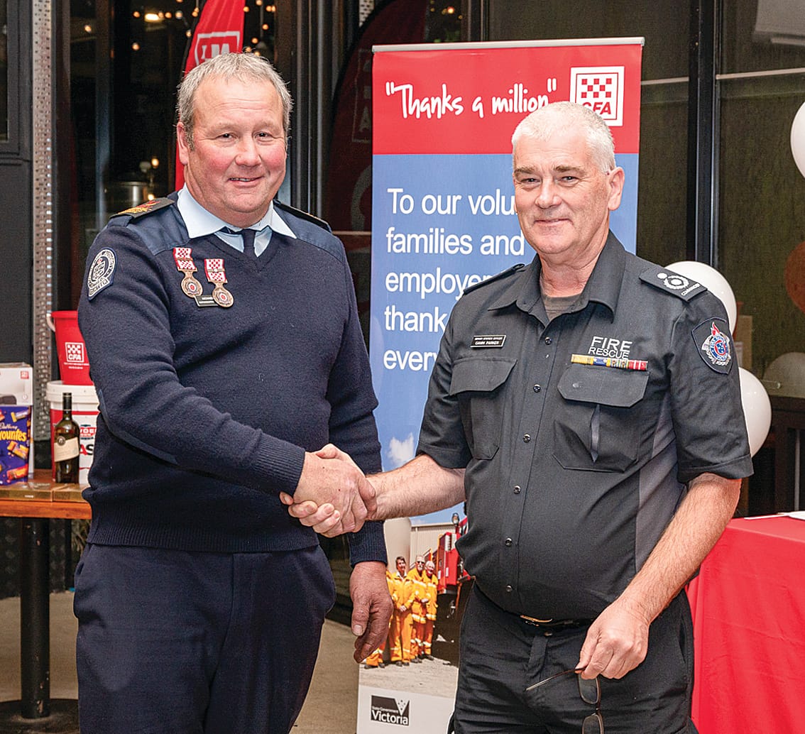 CFA Catchment Commander Gavin Parker presenting twenty-five-year service award to Michael Blogg.