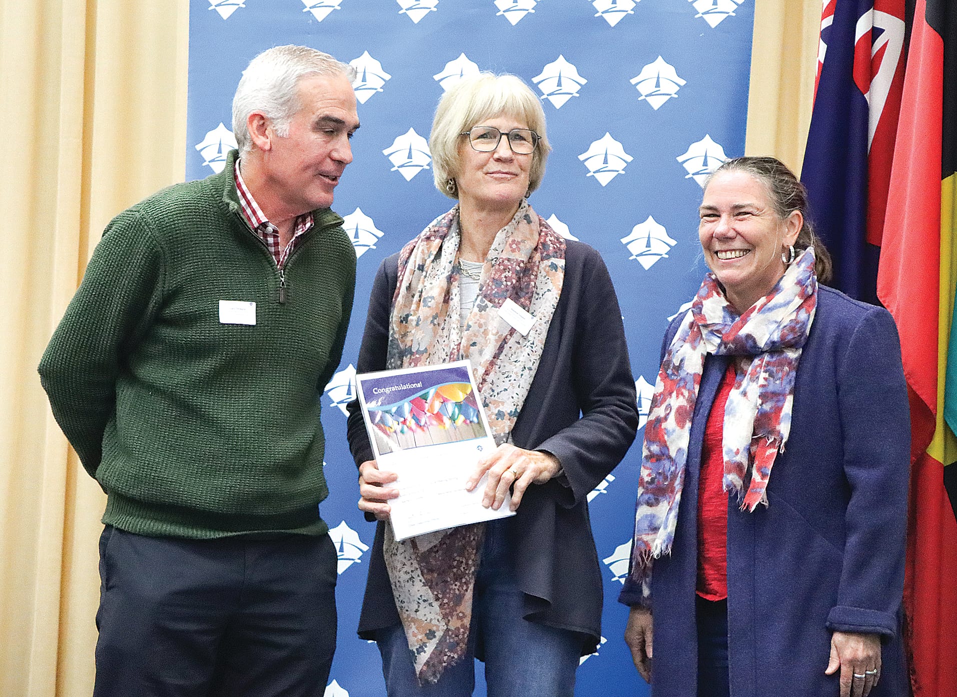 Craig Panagiris and Noelene Cosson collect $5000 on behalf of Korumburra Staying Strong to help with a volunteer thank you and advancing the Korumburra Emergency Plan or the Community Plan, with Cr Sarah Gilligan. A12_3124