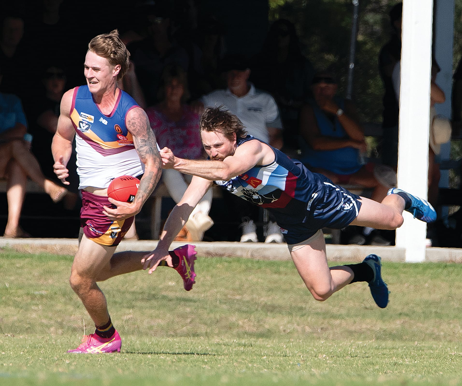 Jack Soroczynski flies at his Dusties opponent in an attempt to win the ball.
Photos: Anna Carson