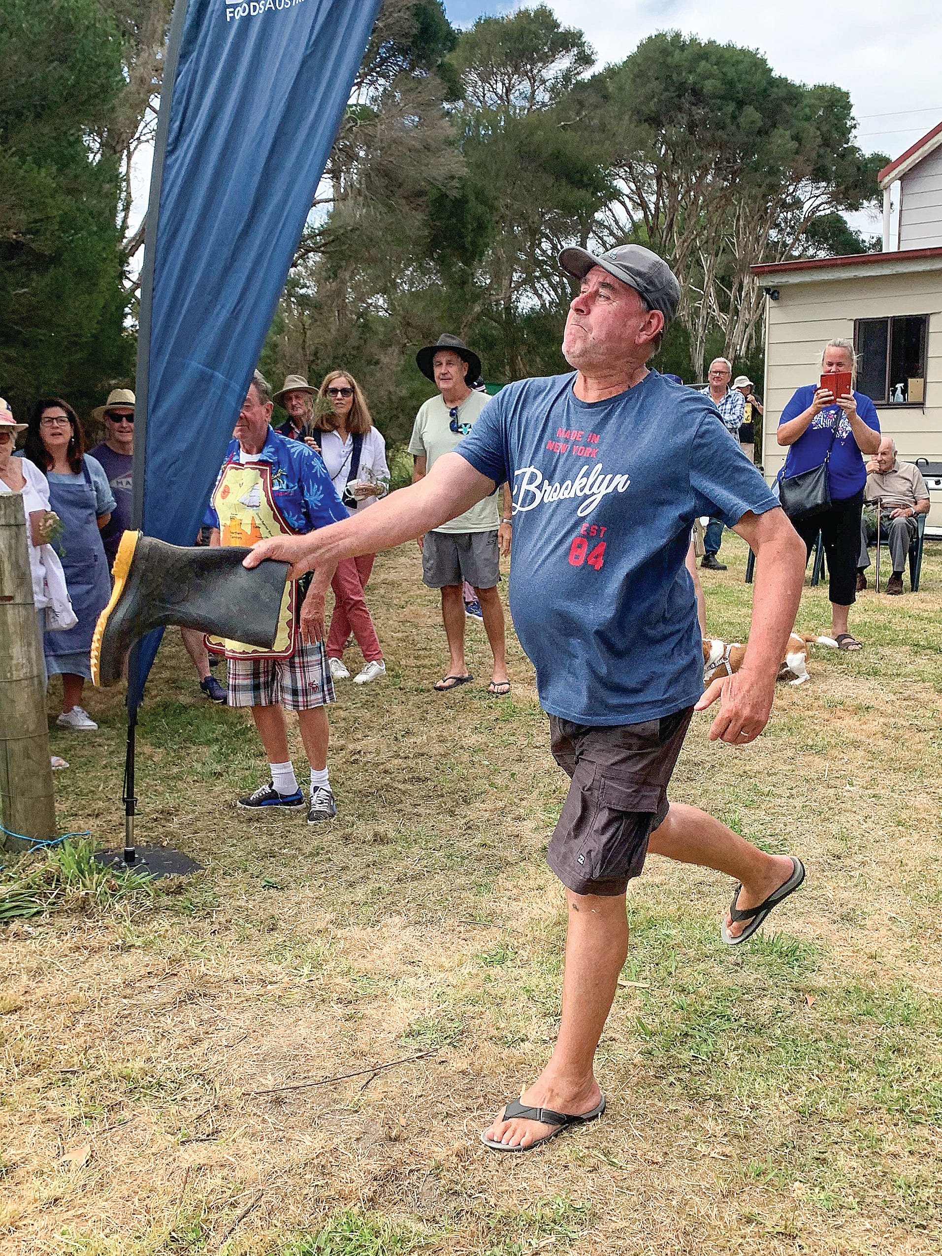 Darren tries his hand at the gumboot throw. 