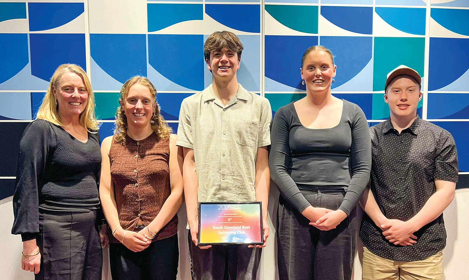 South Gippsland Bass (SGB) coach Lorri McKenzie with squad, Trinity, Archie, Hannah and Josh at the Swimming Victoria awards night.
