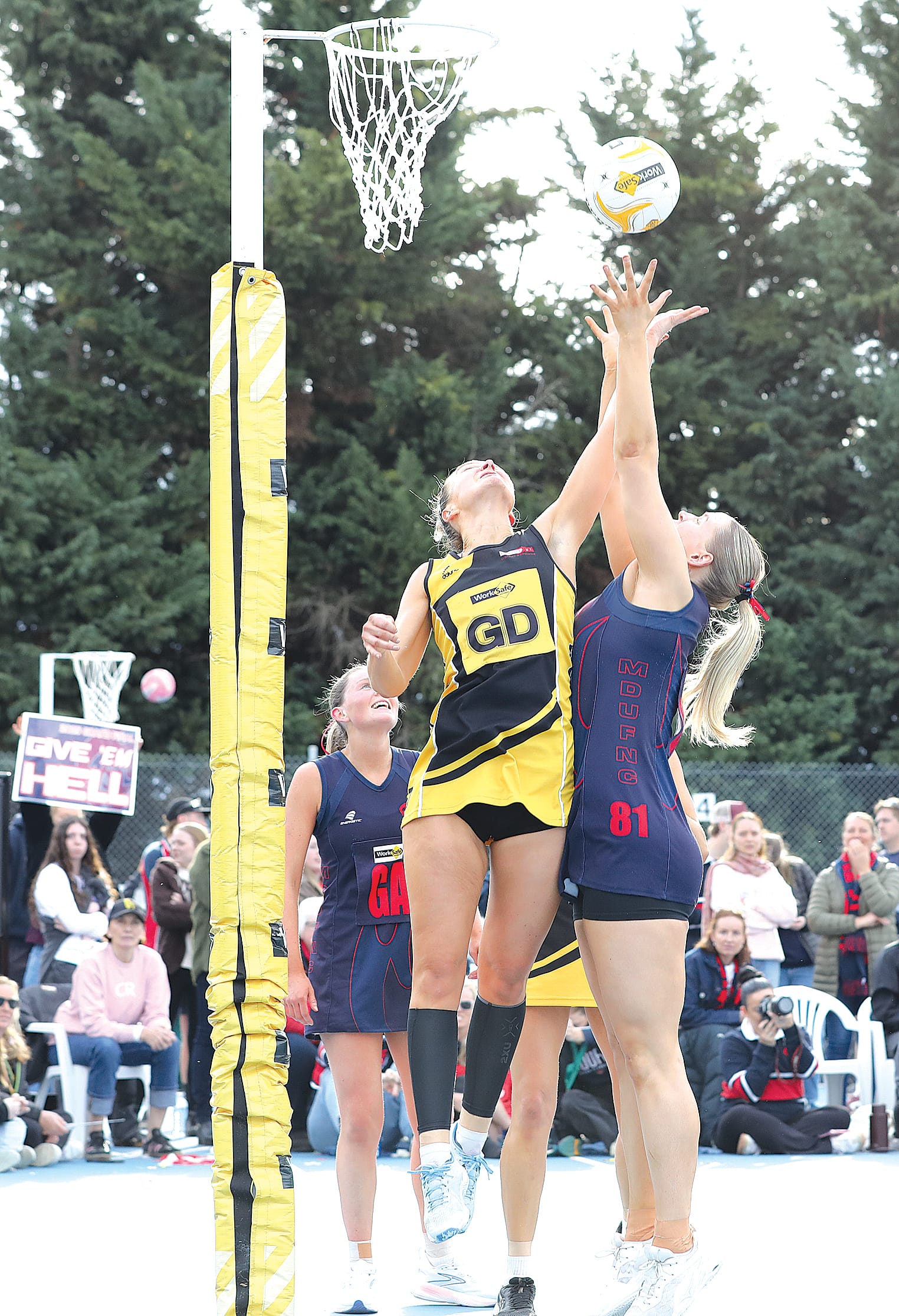 Foster’s Madeline Stewart leaps for an unsuccessful rebound from Alahna Arnason, who lands the second shot in goal. C35_3725
