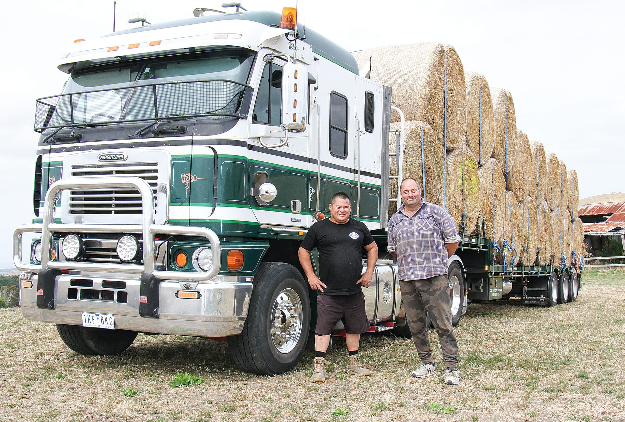 Woolamai farmer Paul Kent and volunteer driver Creighton Dickie with 17 tonnes of donated hay for drought-stricken SA. B11_0425