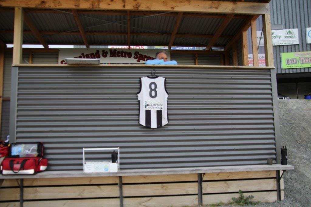 The late Noah Peacock's Number 8 guernsey is displayed on the front of the Poowong coach's box during the senior match as a mark of respect for their team mate, killed in a car crash on his way to training last Thursday.