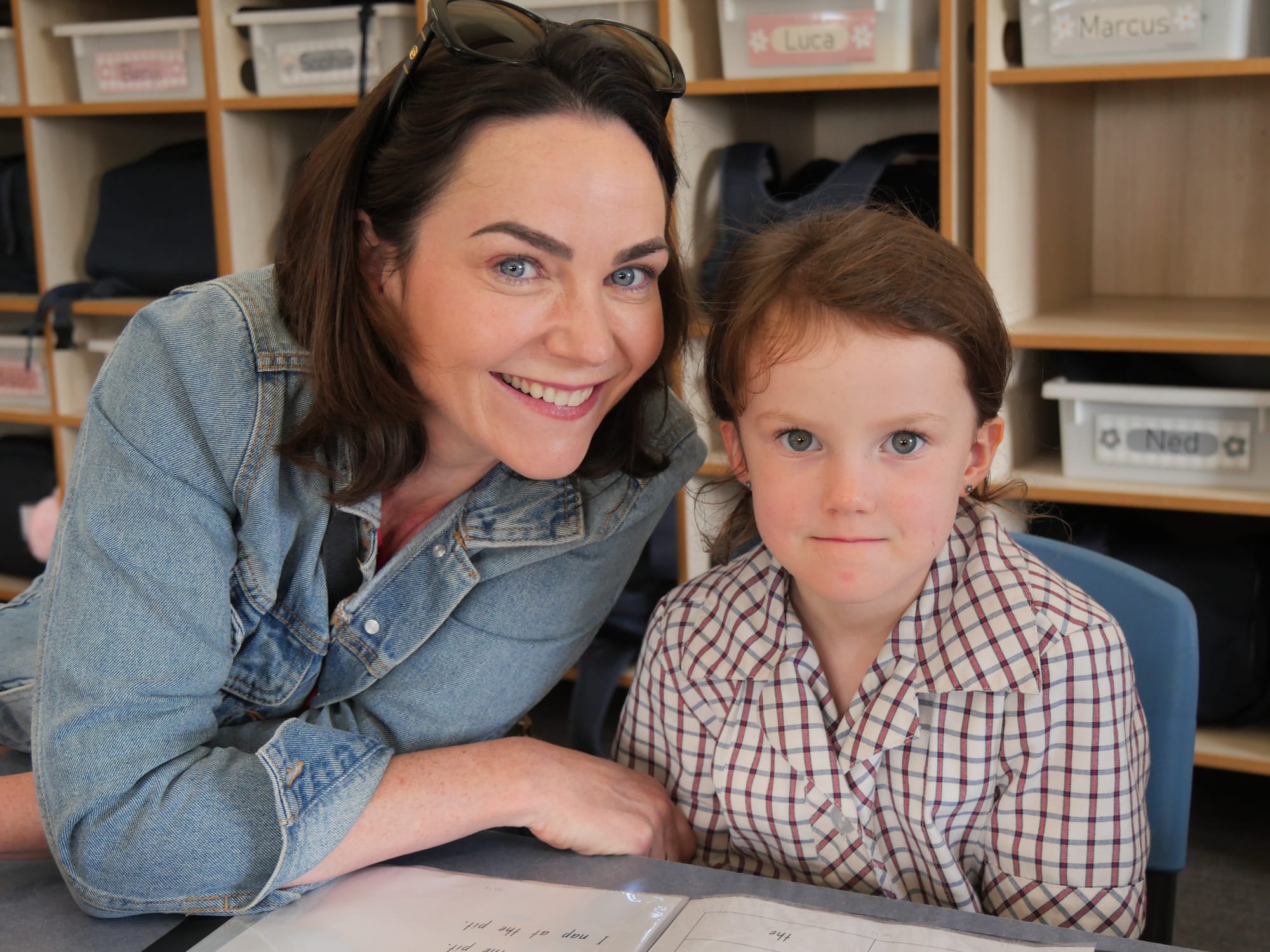 Newhaven College Prep Asha Dillon shares her reading folder with mum Denise. They are ready to read at home to support Asha’s daily learnings at school.