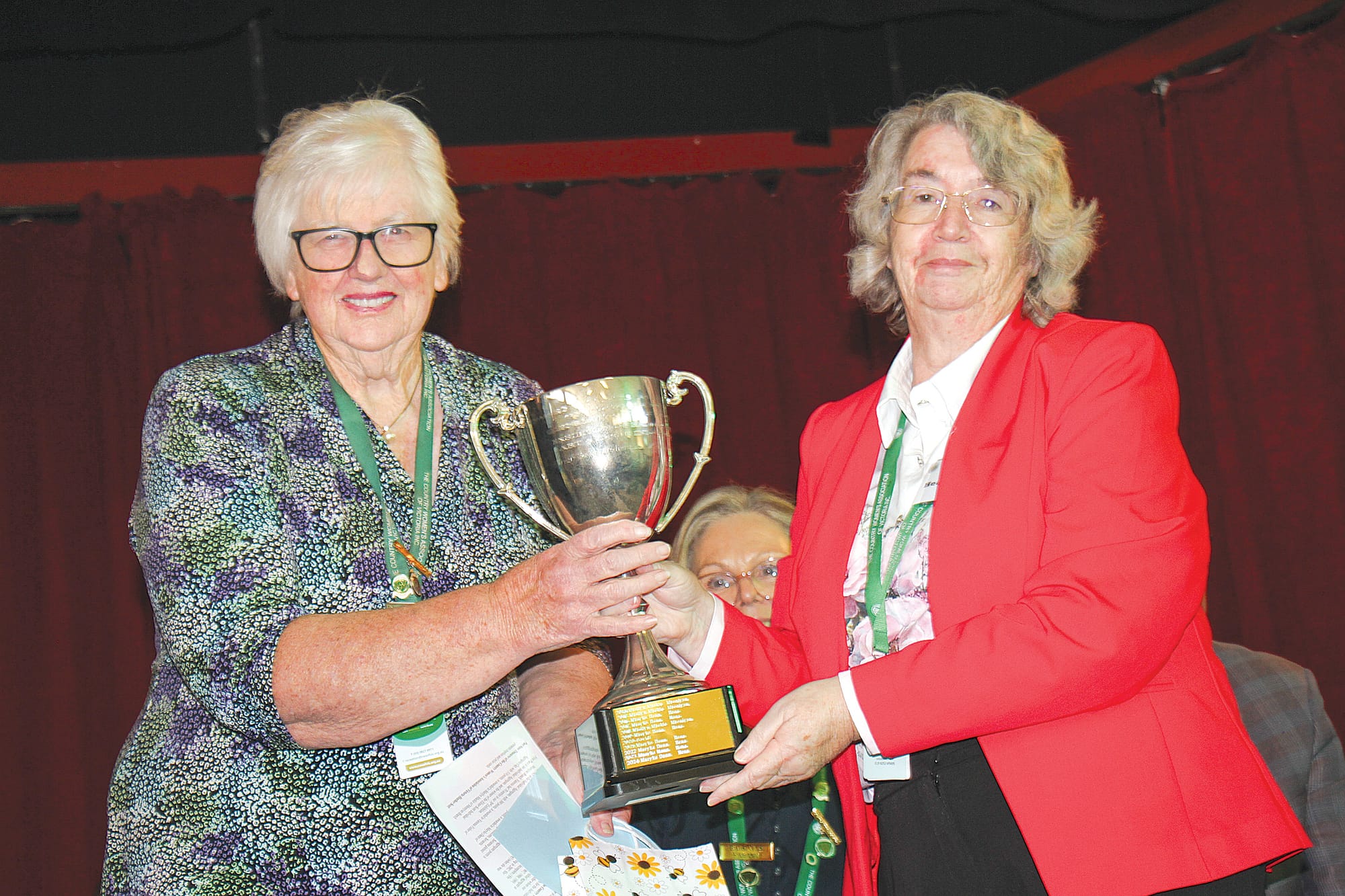 Gippsland Hills Group President Marilyn Mackie (Meeniyan Branch) accepting the Elinor Scott Individual Aggregate Cup from Past CWA State Treasurer Heather Scott. B43_1425