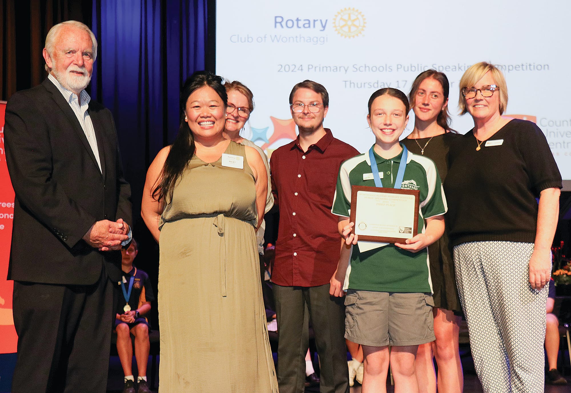 Don Paproth, Nicki Chung, Amanda Mc Mahon, Alex Charlton, Sophie Hogan, and Sarah Bourke congratulate Leila Andrews on third place at the 2024 Primary Schools Public Speaking Competition. Z24_4324 