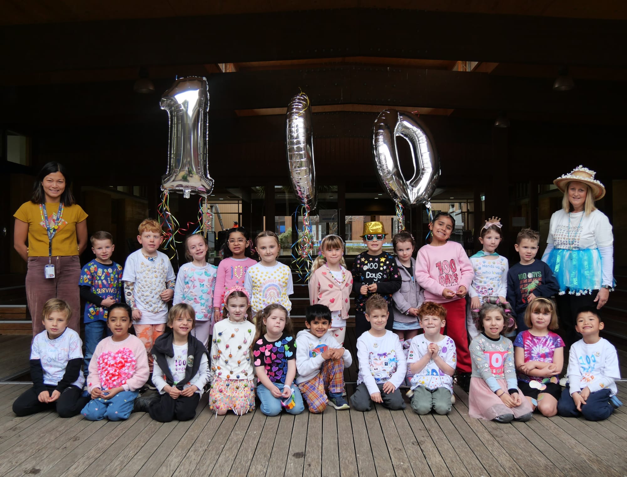 Class Prep B with the Teacher Karen Faulwetter and Teacher's Aide Nala Taylor pose for a group shot after parading the school in their costumes.