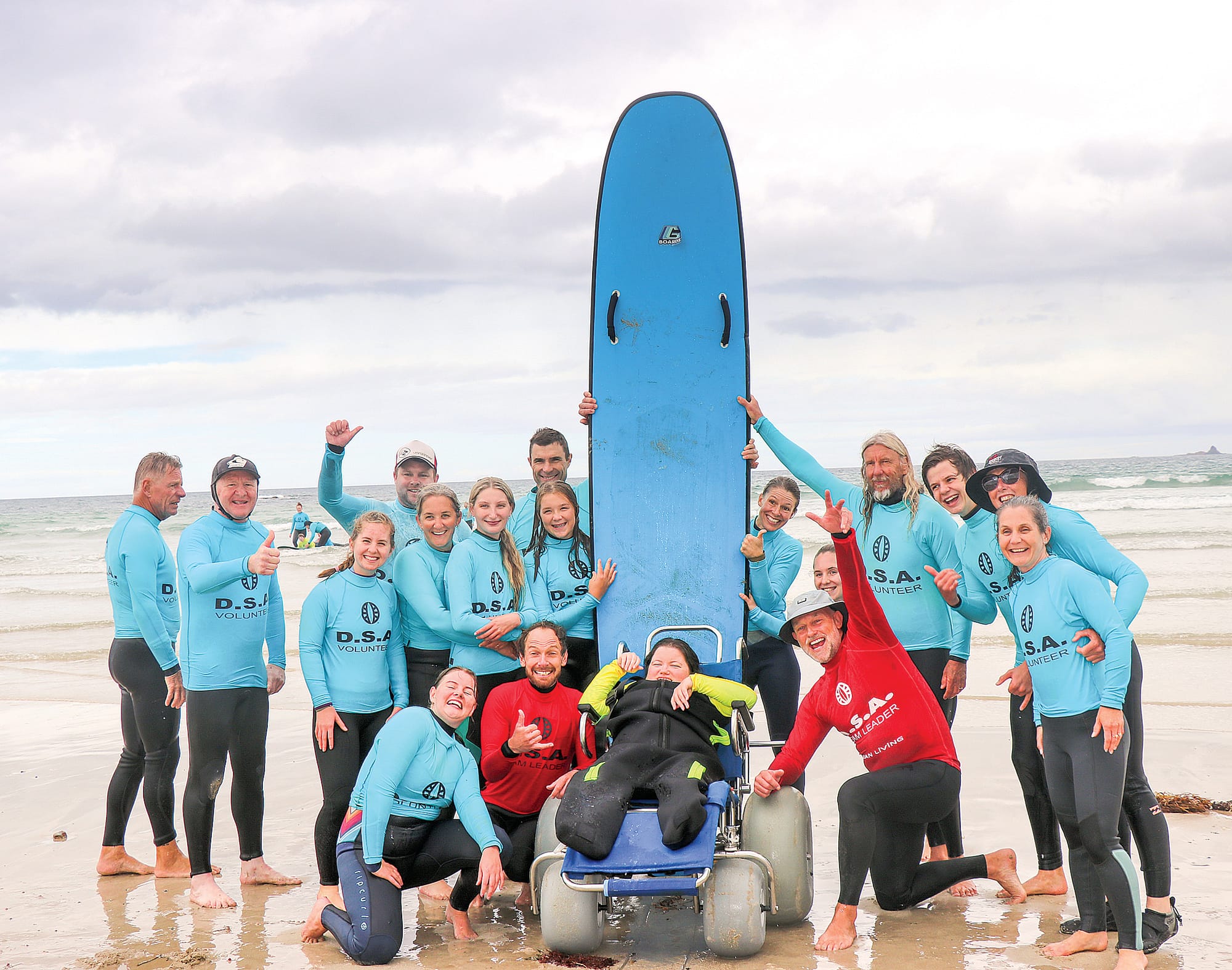 Z12_4622 DSA team leaders, volunteers and primary carers work seamlessly together to help those with a disability enjoy the ocean safely. Z12_4622