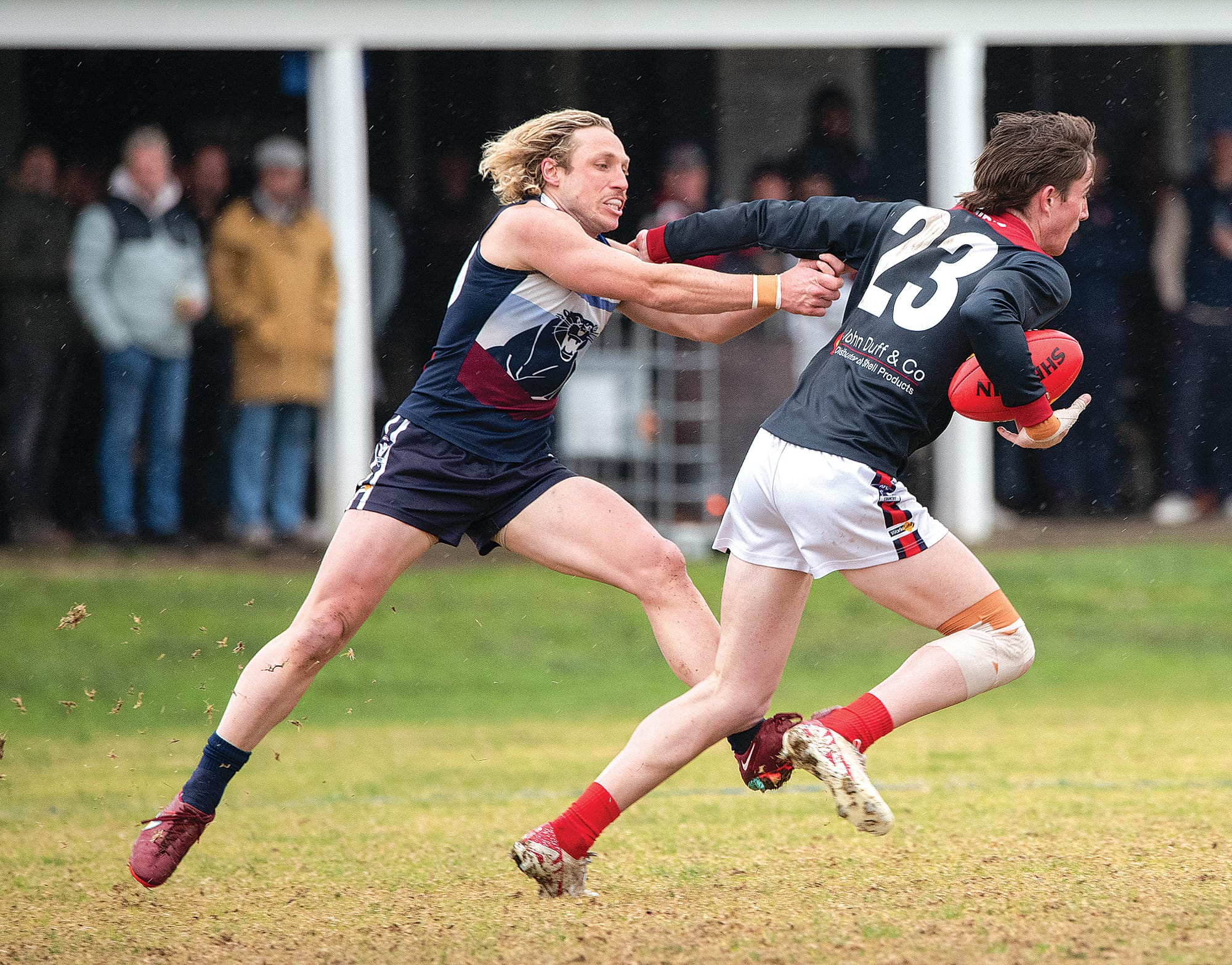 Seth Ohehir slips through Jake Weightman’s grasp. Photos: Anna Carson
