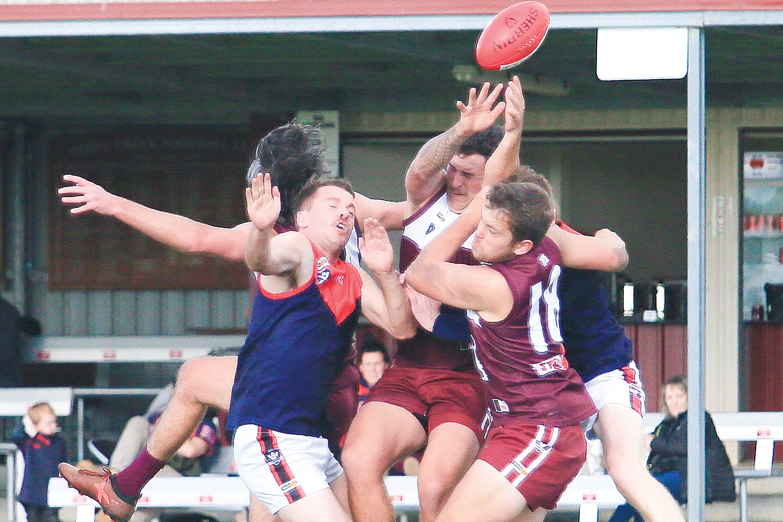 All eyes were not on the ball, but a tough contest saw the Demons come out on top by 6 points. Photos: Gerard Bruning.