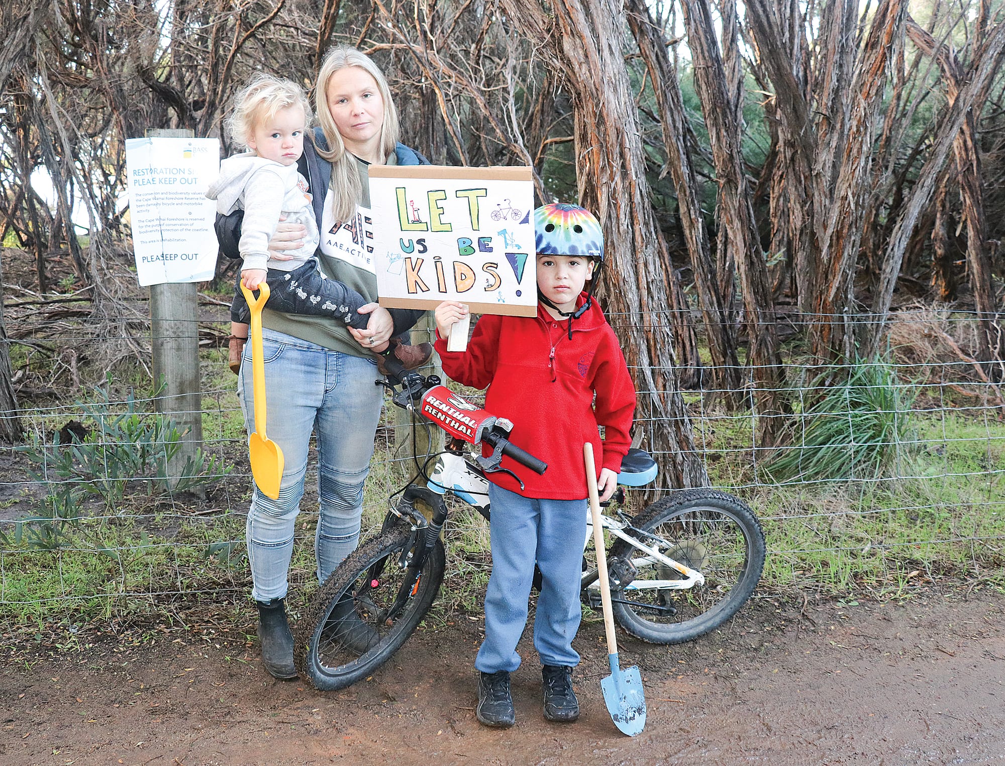  Melissa Drager and her children Cody and Tyler pictured at the Cape Woolamai foreshore bike track after council fenced it off and declared it ‘illegal’. Z12_3023