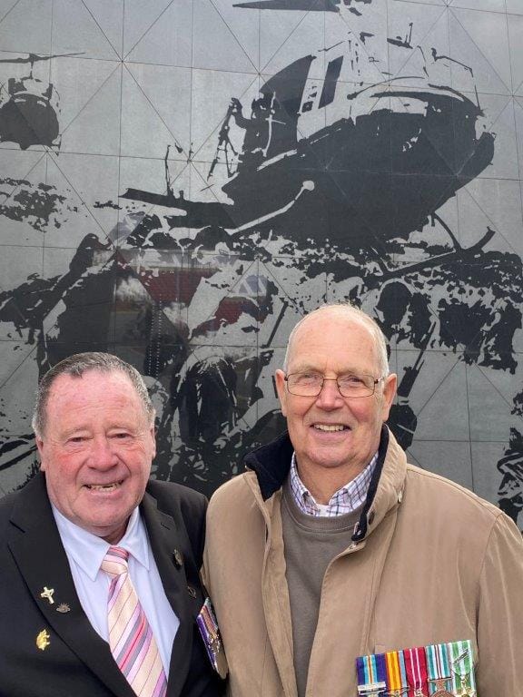 Former Wonthaggi resident, Stan Whitford, right, with one of his 5 Platoon, B Company, 7RAR mates, Neal Hasted of Ipswich in Qld featured in the Australian Vietnam Forces National Memorial that was the centrepiece of last Friday’s 50th anniversary of Australia’s withdrawal from the Vietnam War. Above them, etched into the memorial wall is the image of Leongatha’s Rob Fennell.