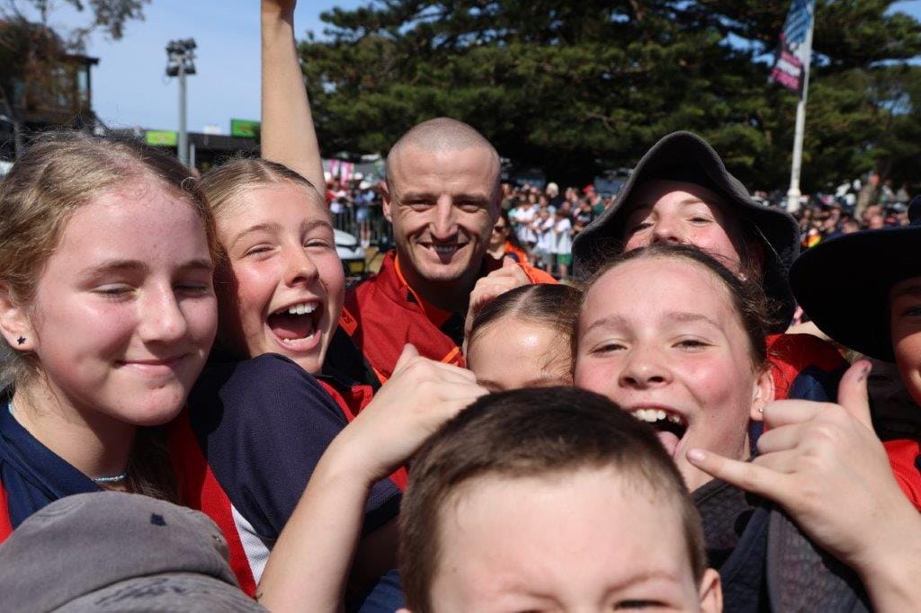 That’s Aussie GP 500 hope Jack Miller in there somewhere, being mobbed by the kids from the San Remo Primary School ahead of the Home Coming Ride across the San Remo Bridge on Thursday.