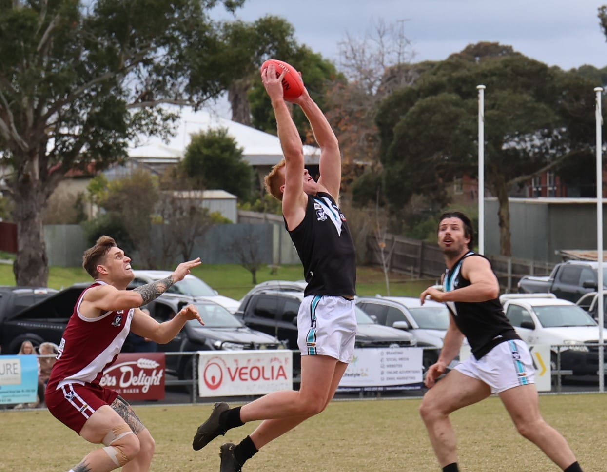 Kyle Reid stretches to take a nice mark at half back.