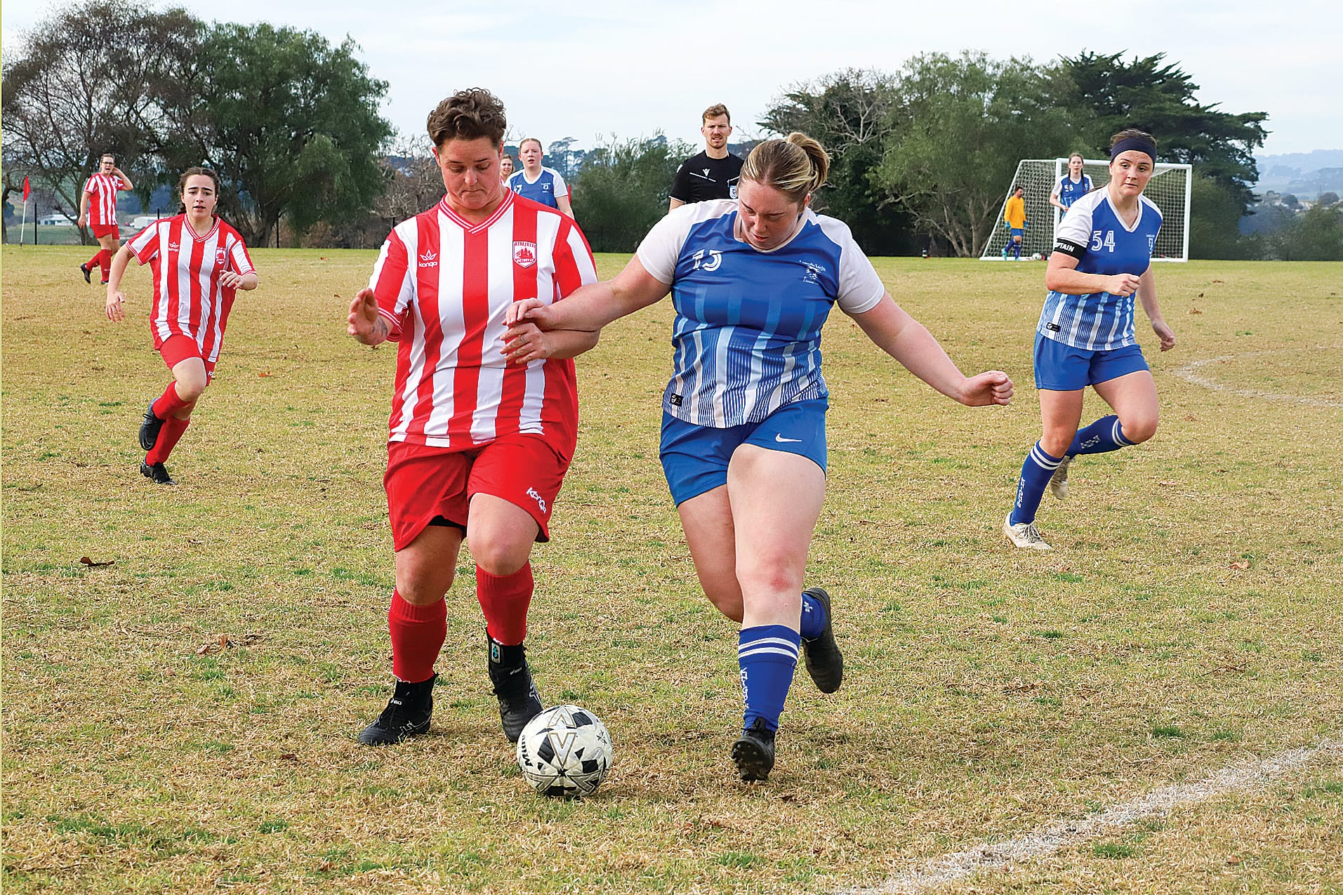 Leongatha’s Molly Gurnett pressures her Trafalgar opponent. 
