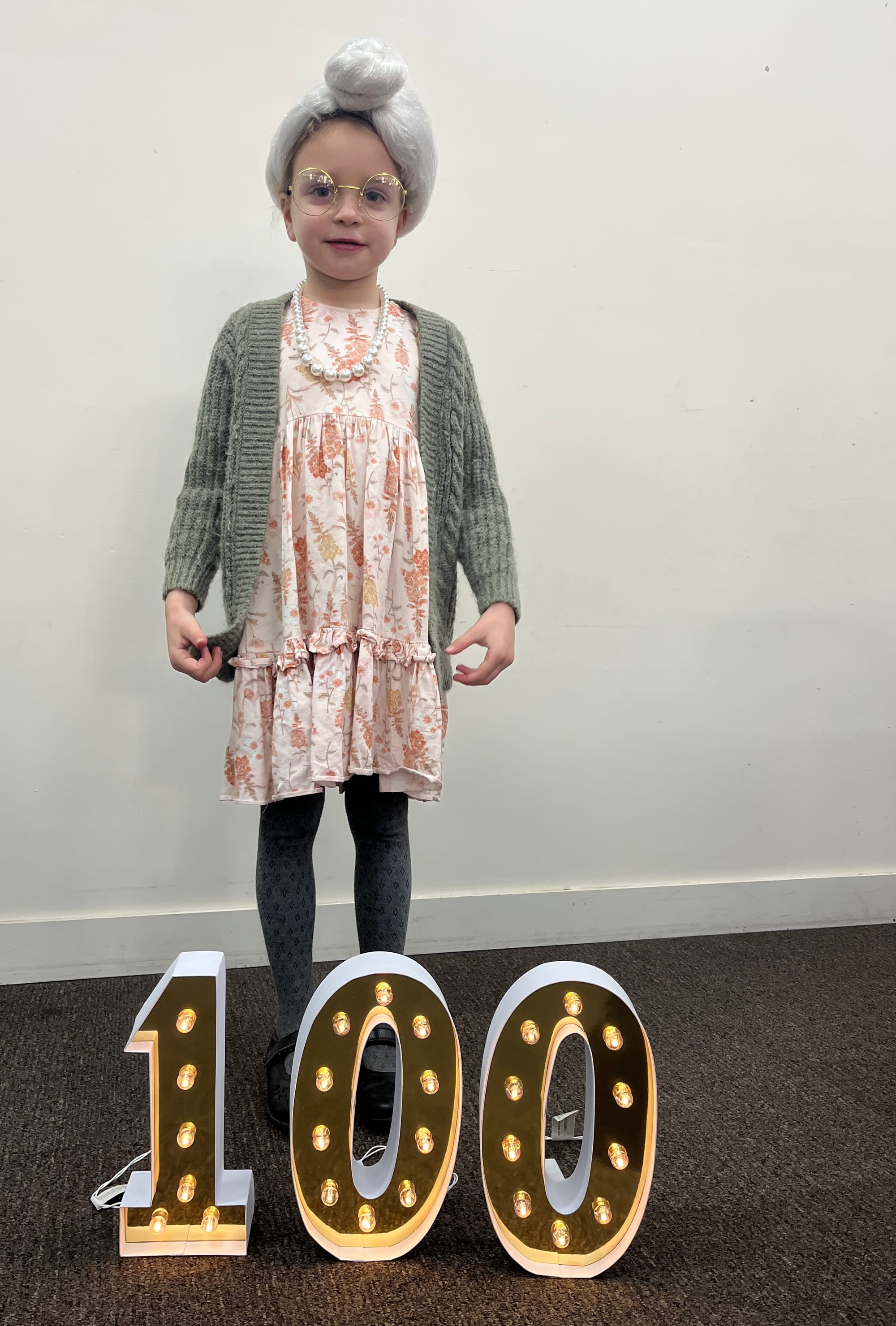 Evie with her carefully curated hair wrap.
