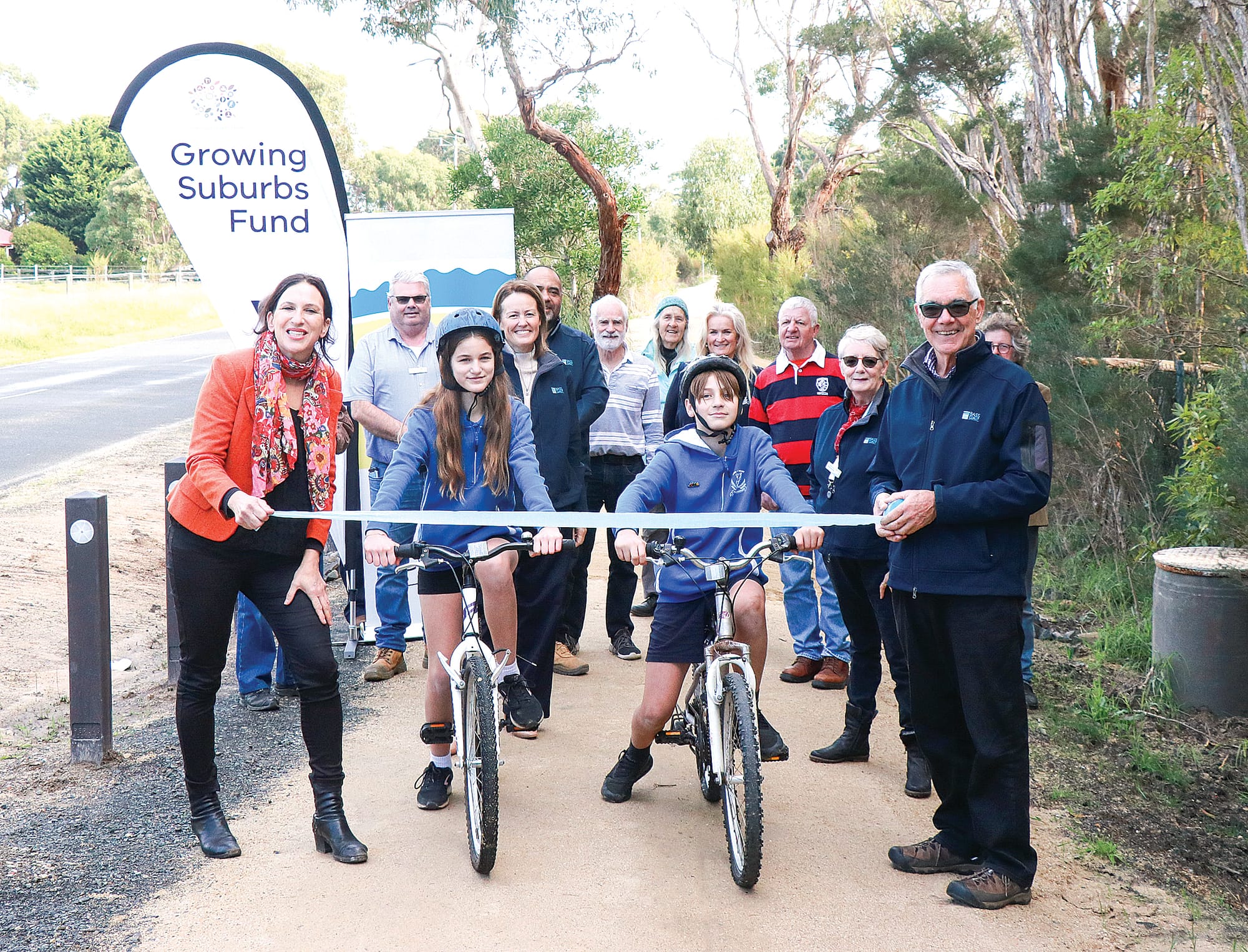 MP for Bass Jordan Crugnale together with Bass Coast Shire Council Mayor Cr Michael Whelan and fellow councillors invited Bass Valley Primary School students Lizzie and Miller to officially open the Guy Road six-kilometre-long shared pathway in Corinella. Z03_2323 