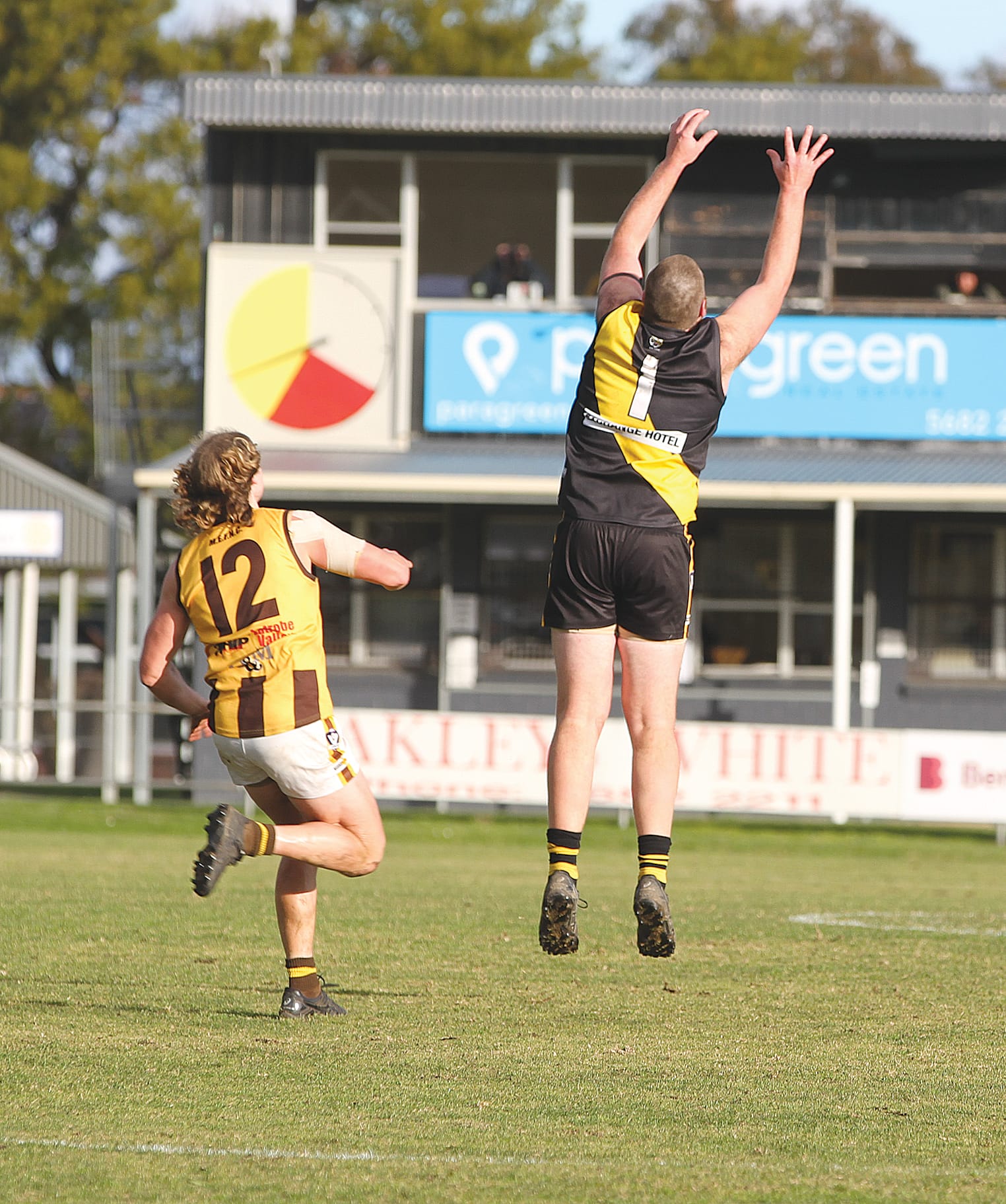 Foster’s Mitchell Allott outpacing and outplaying Morwell East to take a soaring mark at the expense of the Hawk’s Patrick Quinn. B109_3125