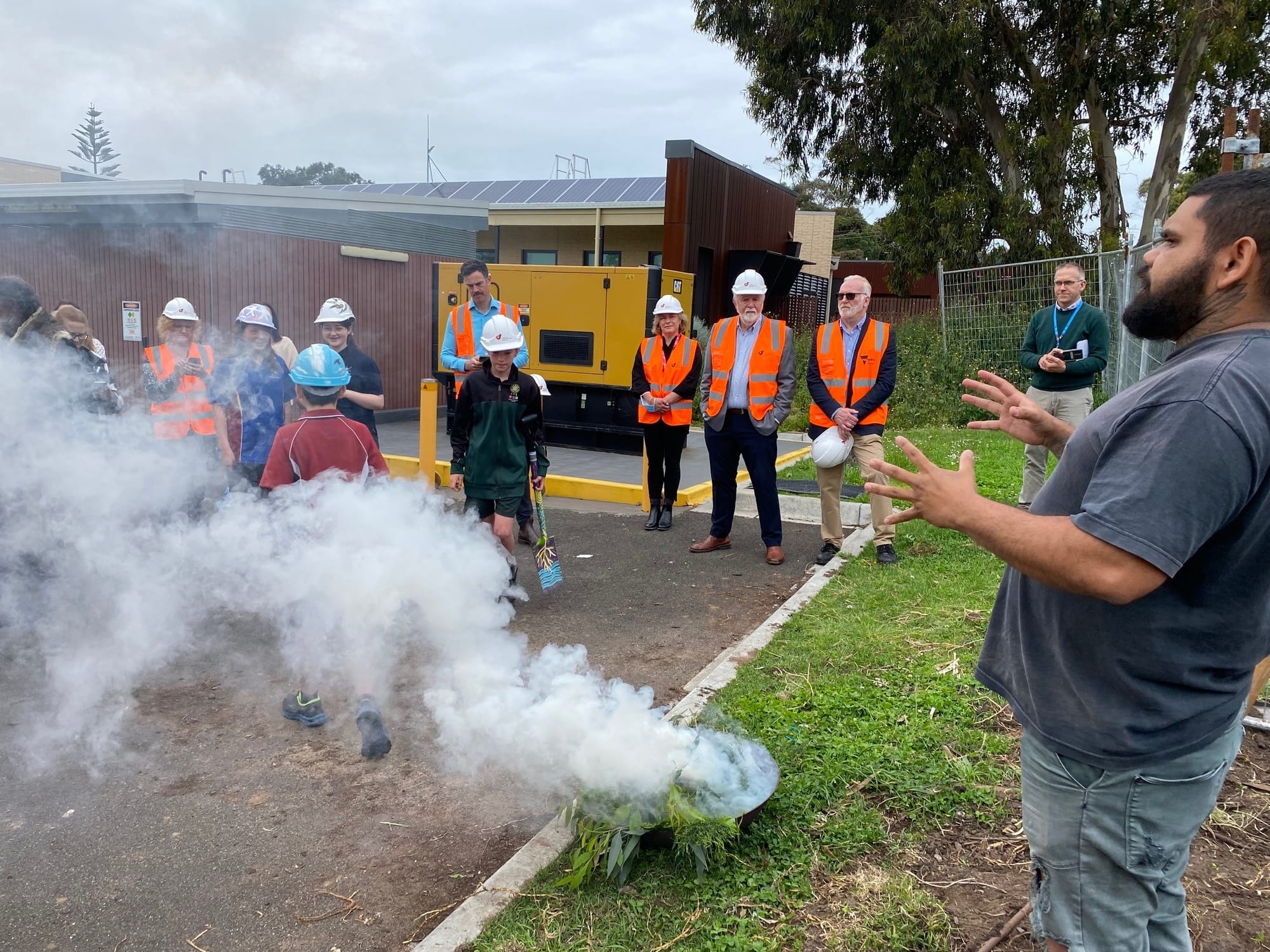 Jungala Ellis (Wemba Wemba, Yorta Yorta & Gunai Kurnai) explains the significance of the smoking ceremony and the three types of leaves used in the ceremonial fire for the start to work on the Phillip Island Community Hospital project.