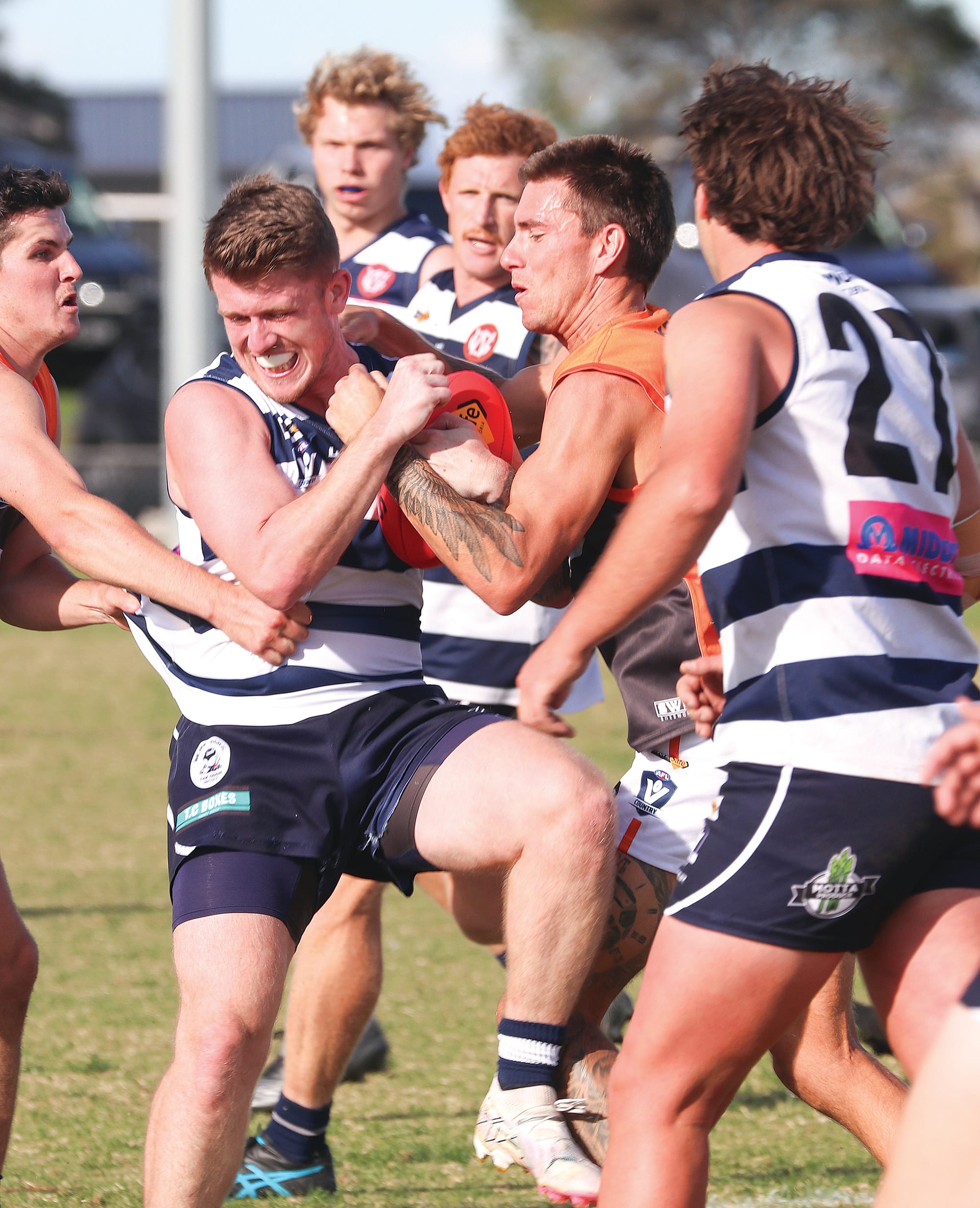 Josh Hopkins right on Jed Smith in the clash between Nar Nar Goon and Korumburra-Bena. Z38_192