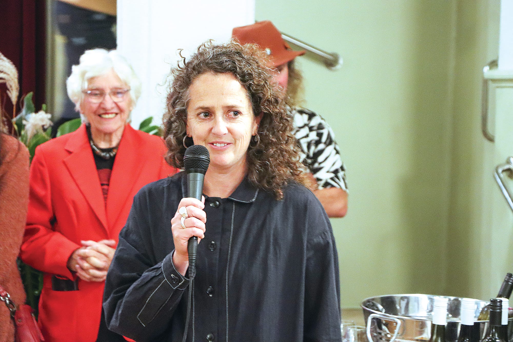 Judge Sarah Parkes speaks about the winning entries. A18_2124