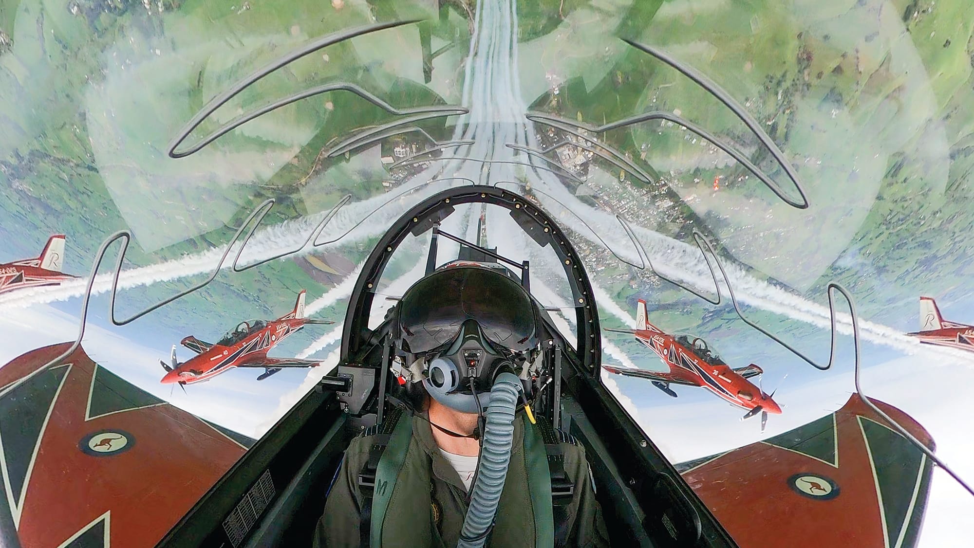 Residents look on from the ground below as the Roulettes perform delta loop over Korumburra. Photo: Australian Defence Force.
