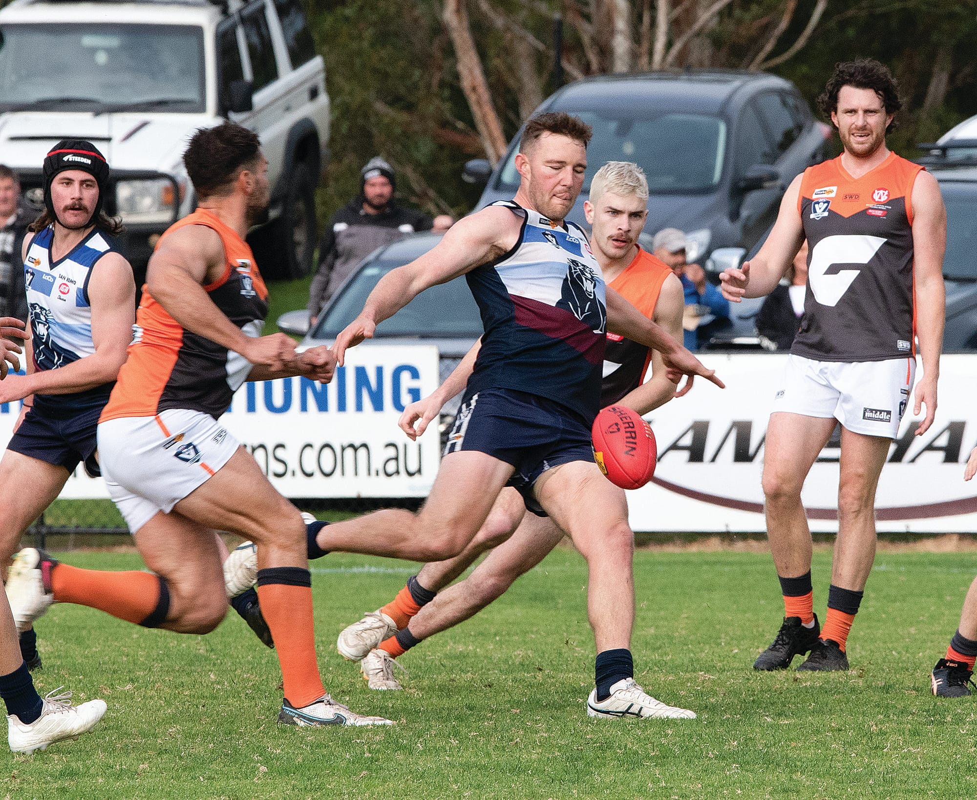Taylor Gibson kicks the ball forward.