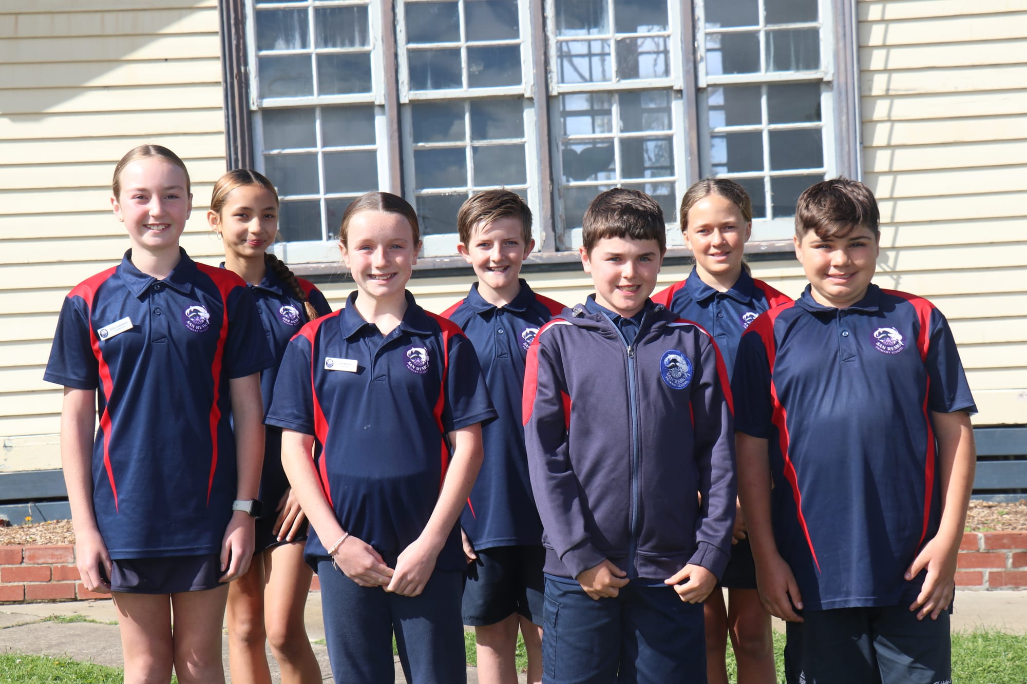 Grade six students of 2024 Bella, Scarlet, Leah, Xavier, River, Leila and Hunter in front of the original San Remo Primary School building. 
