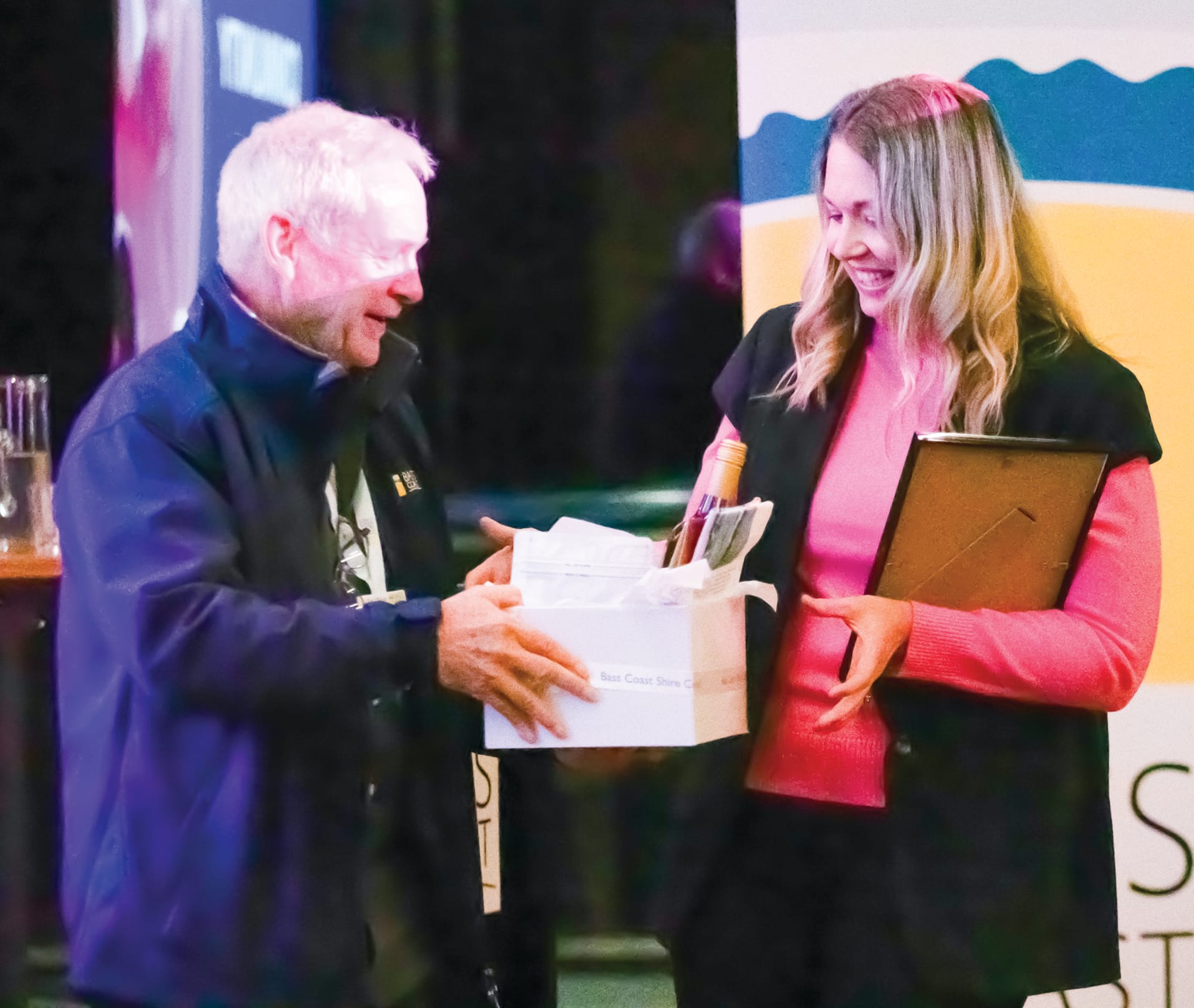 Winner of the Community Leader Award, Sarah Pederson is presented with her gift by Cr Tim O’Brien. Photo by Piers Buxton.