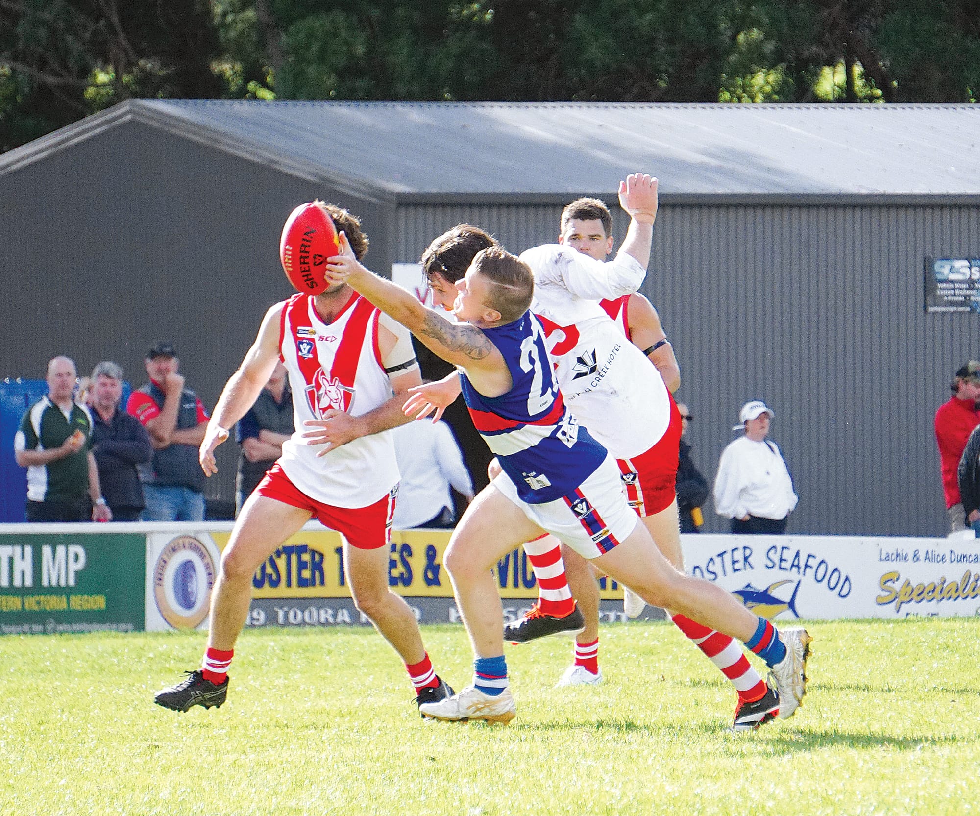 The fight is on; Newborough just keeps the ball at bay from Fish Creek. Ns20_1624