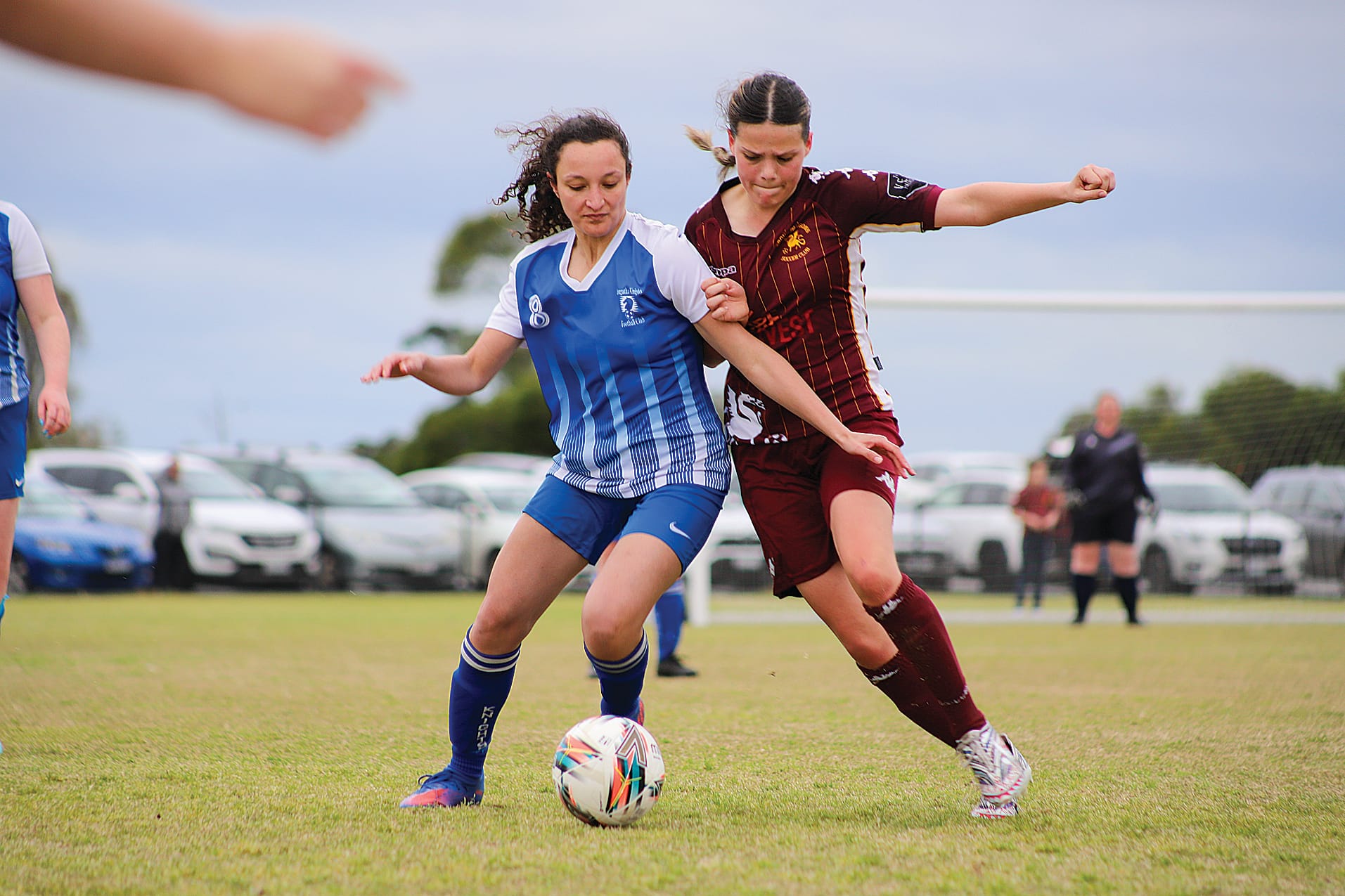 Leongatha’s midfield magician Mikaela Misso battles with Drouin playmaker Brianna Purvis.